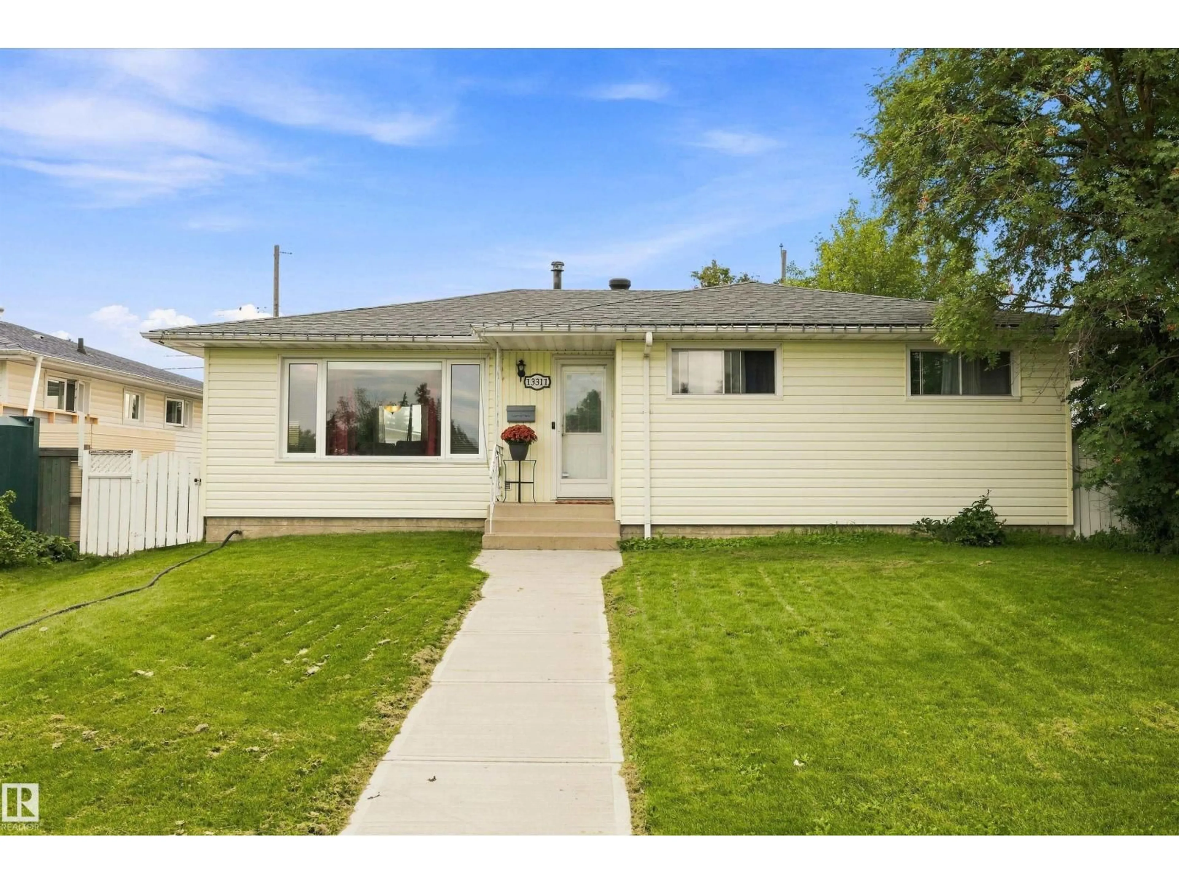 Home with vinyl exterior material, street for 13311 60 ST, Edmonton Alberta T5A0S4