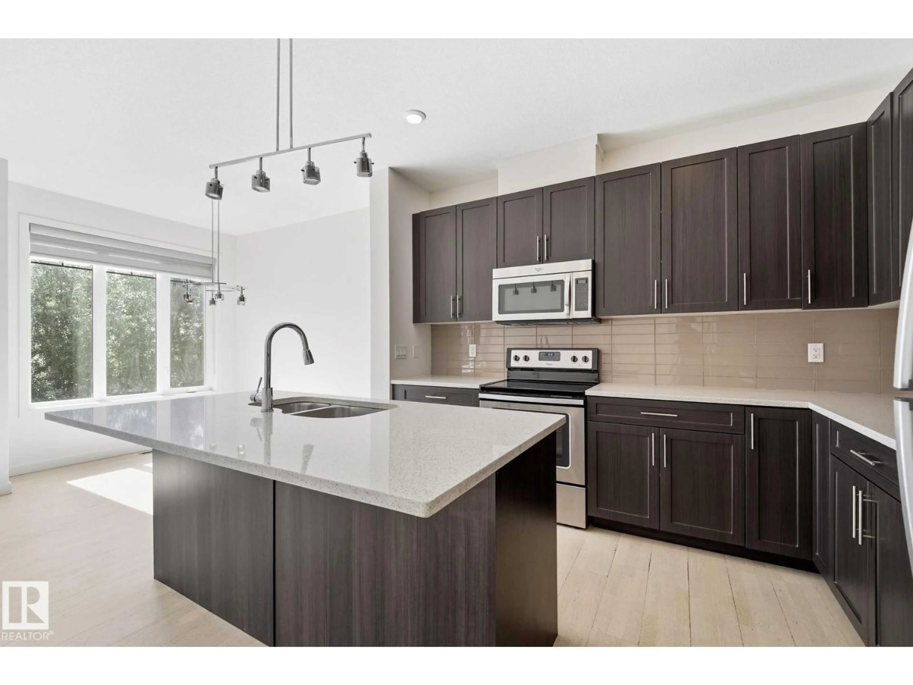 Open concept kitchen, ceramic/tile floor for #47 - 5873 MULLEN PL, Edmonton Alberta T6R0T5