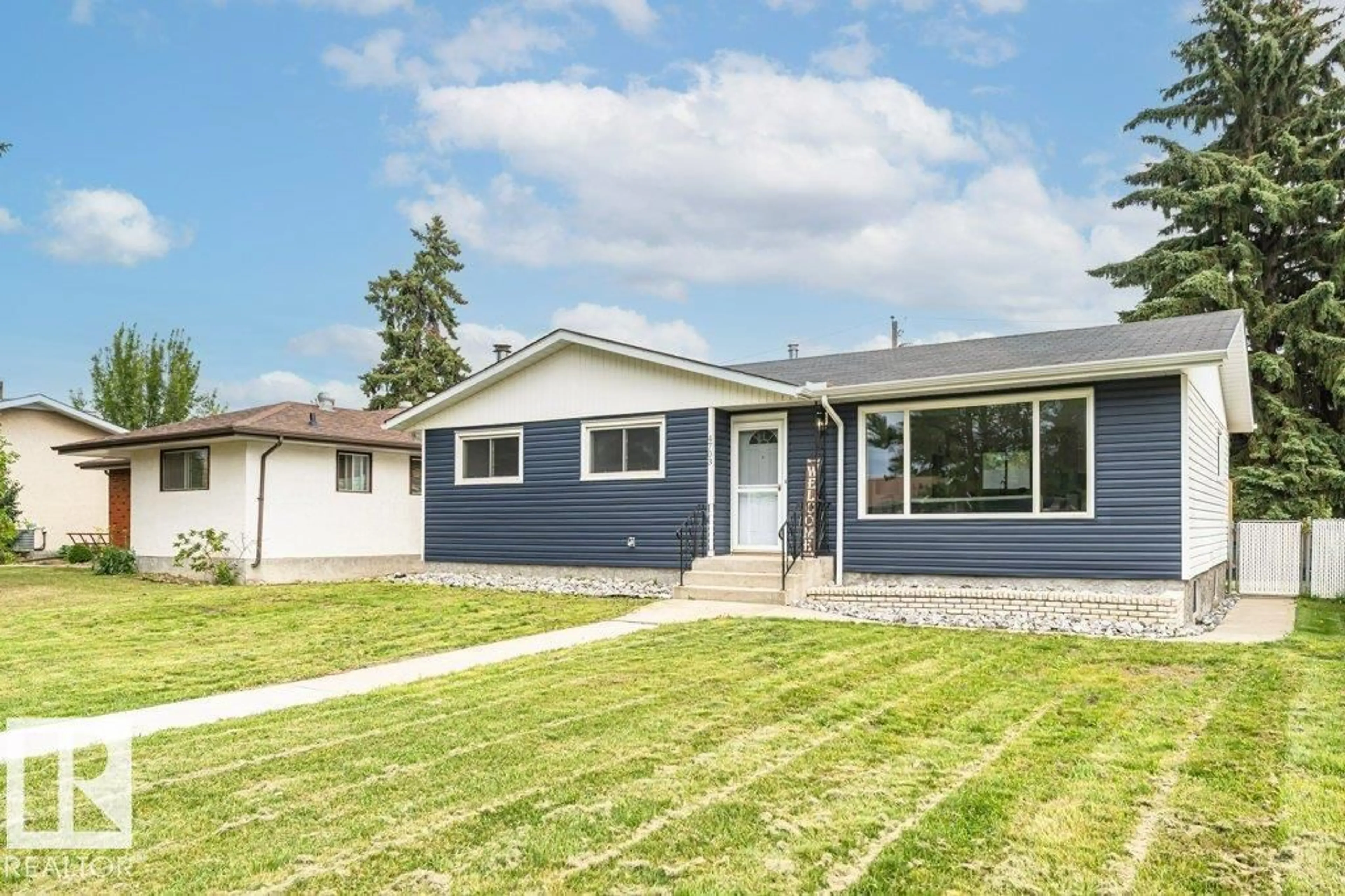 Home with vinyl exterior material, street for NW - 4703 117 ST, Edmonton Alberta T6H3R7