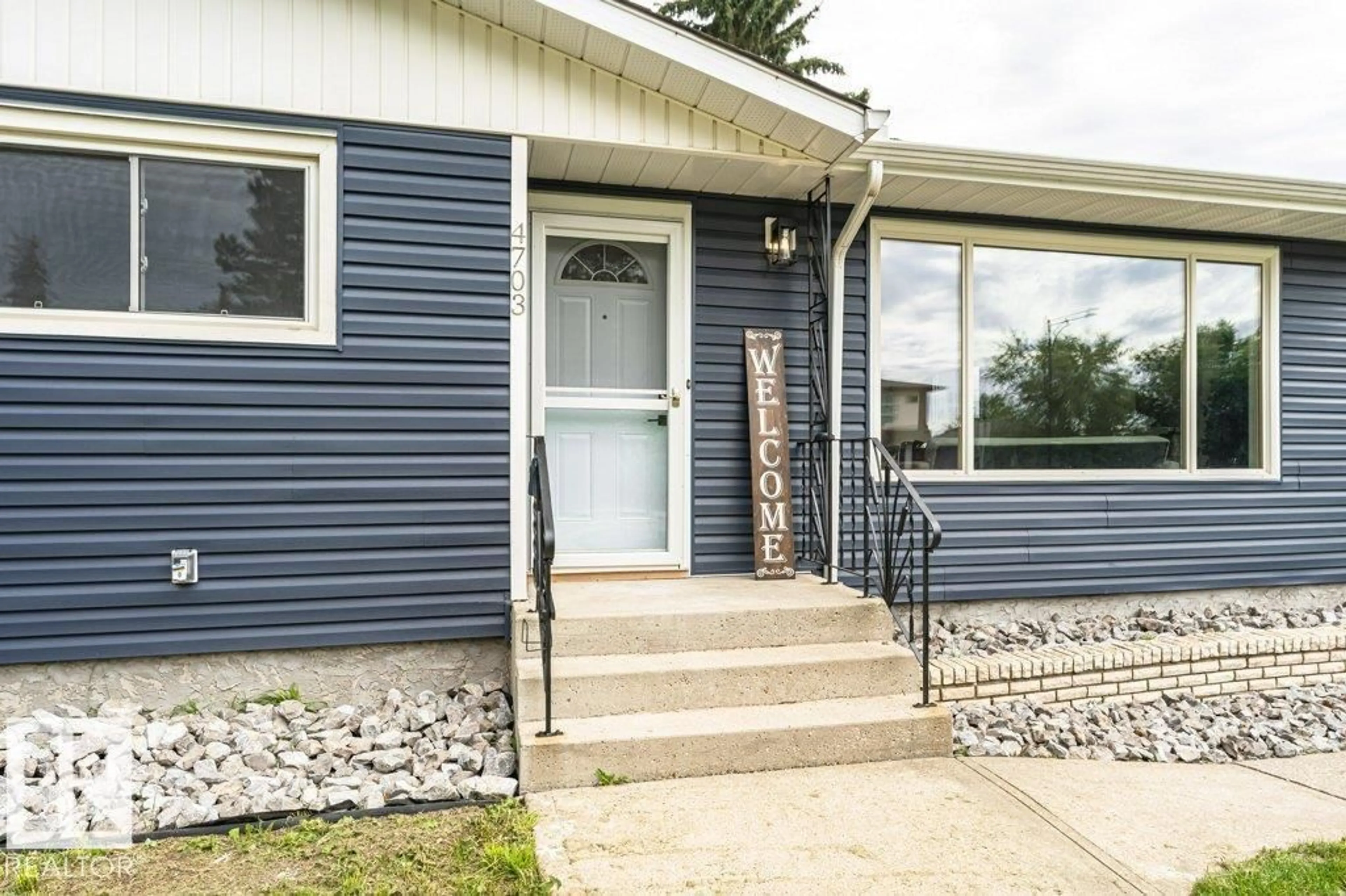 Home with vinyl exterior material, street for NW - 4703 117 ST, Edmonton Alberta T6H3R7