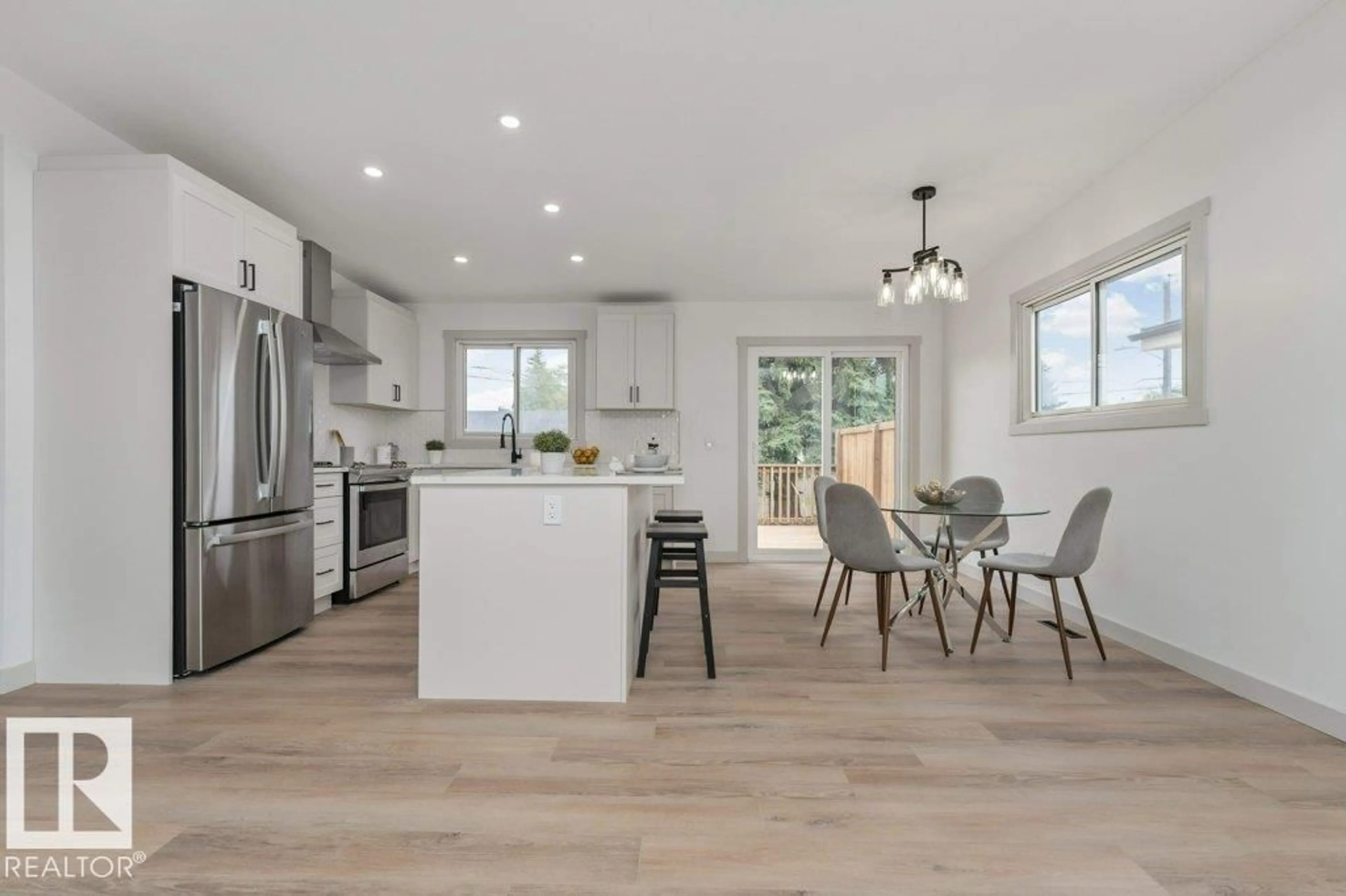 Open concept kitchen, wood/laminate floor for NW - 4703 117 ST, Edmonton Alberta T6H3R7