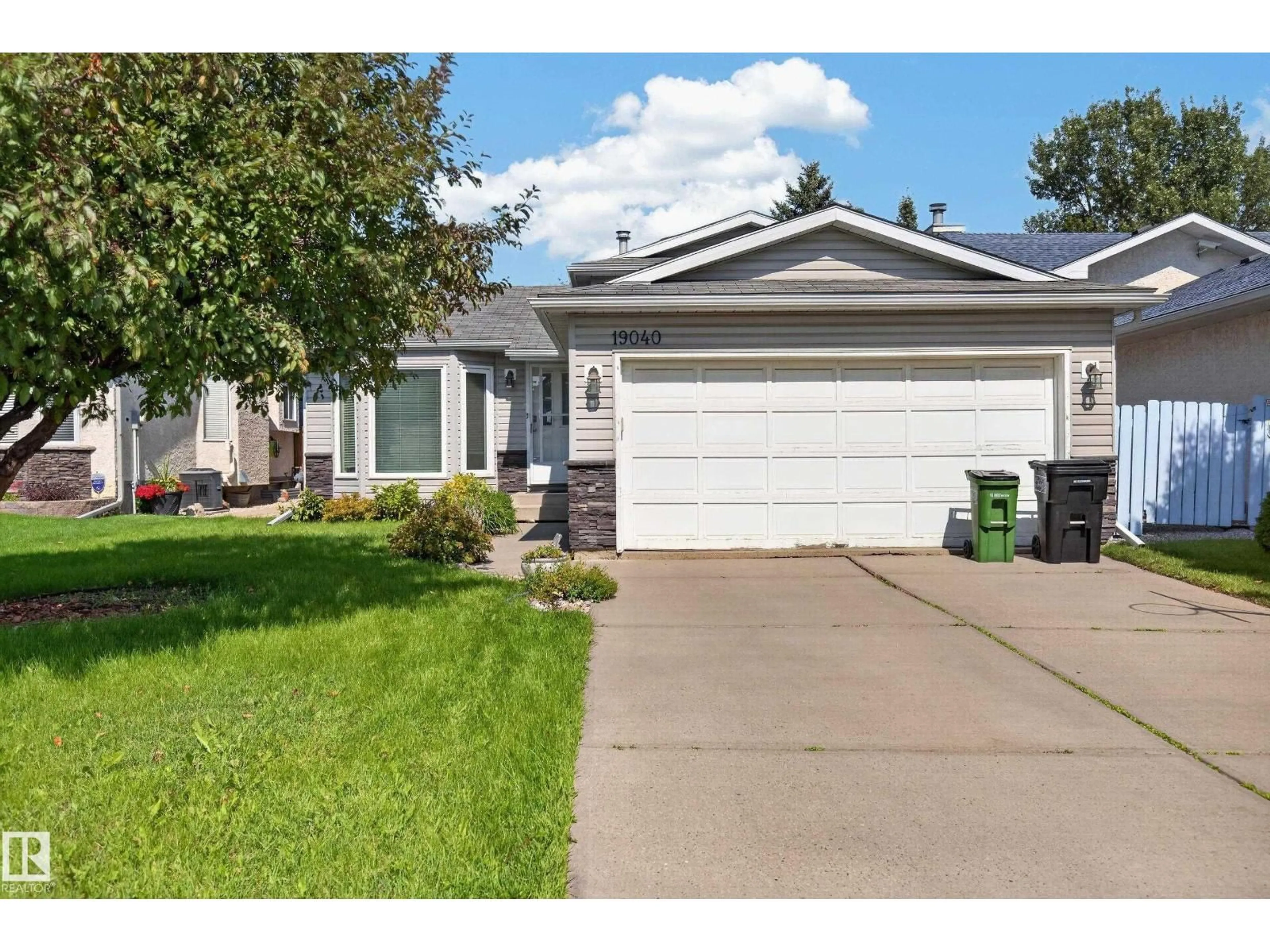 Home with vinyl exterior material, street for 19040 70 AV, Edmonton Alberta T5T5S7