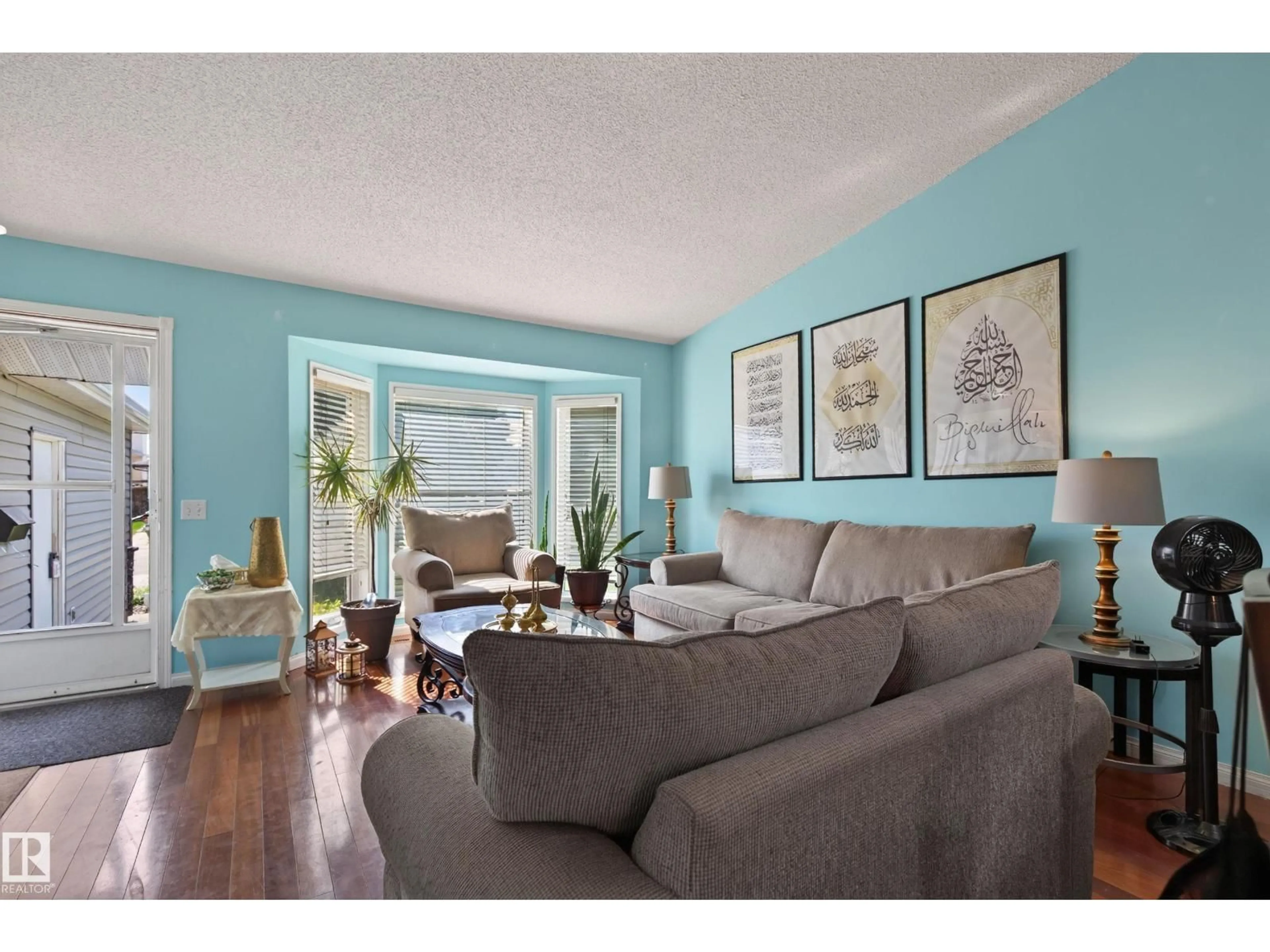Living room with furniture, wood/laminate floor for 19040 70 AV, Edmonton Alberta T5T5S7