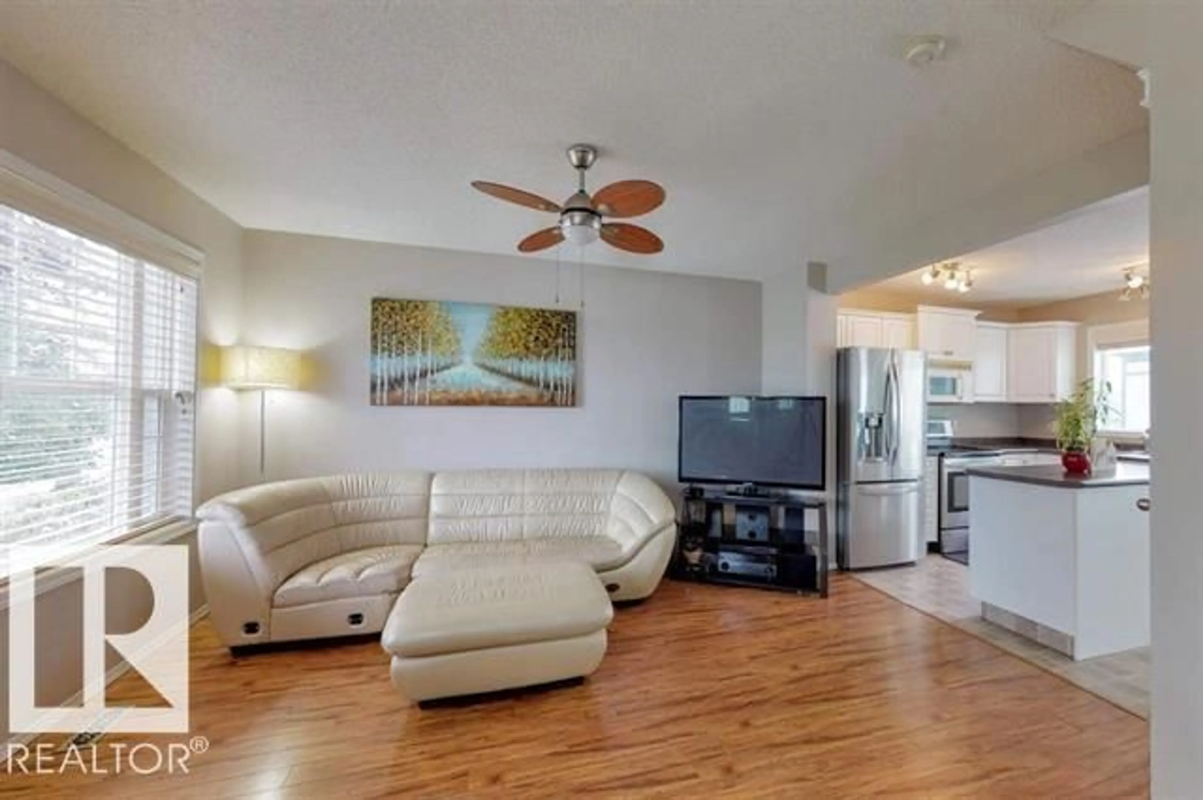 Living room with furniture, wood/laminate floor for 13924 152 AV, Edmonton Alberta T6V1T5