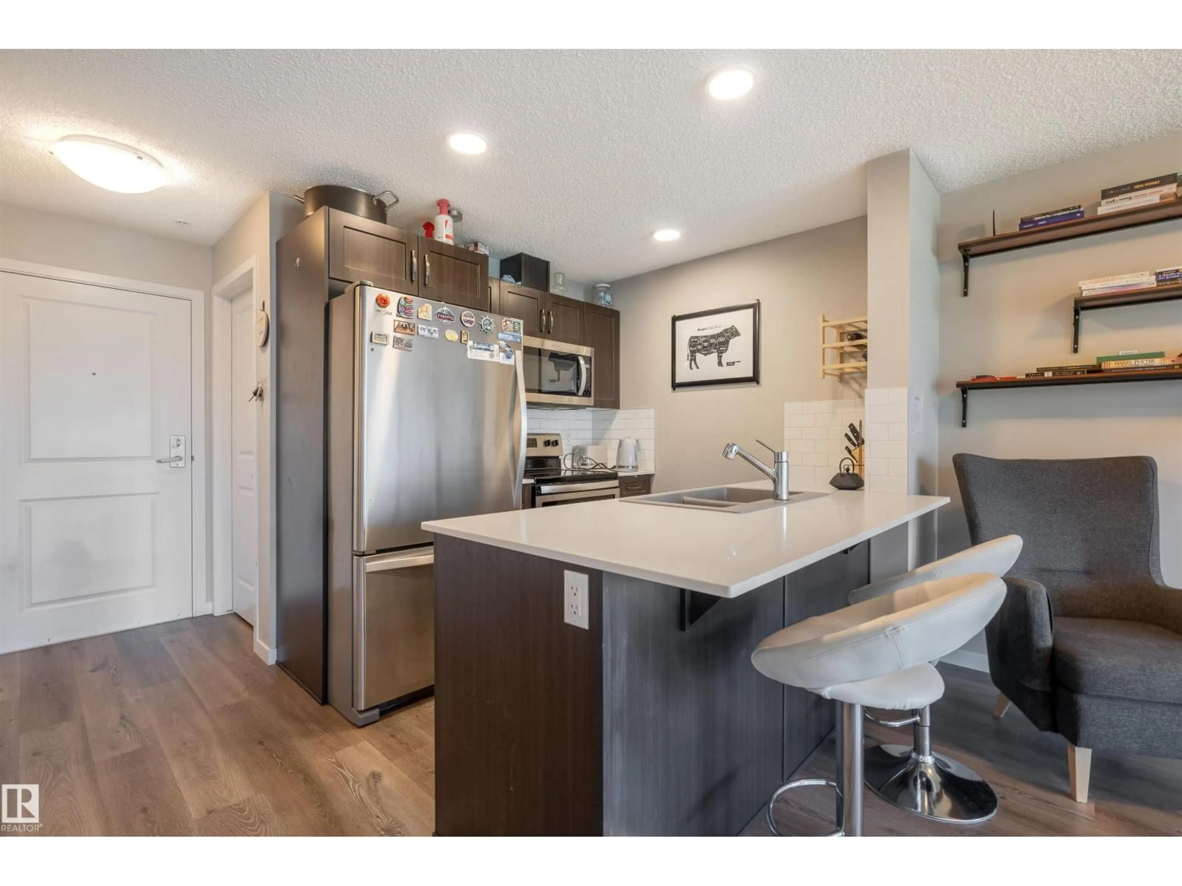 Open concept kitchen, wood/laminate floor for 1818 - 246 RUTHERFORD RD, Edmonton Alberta T6W2K6