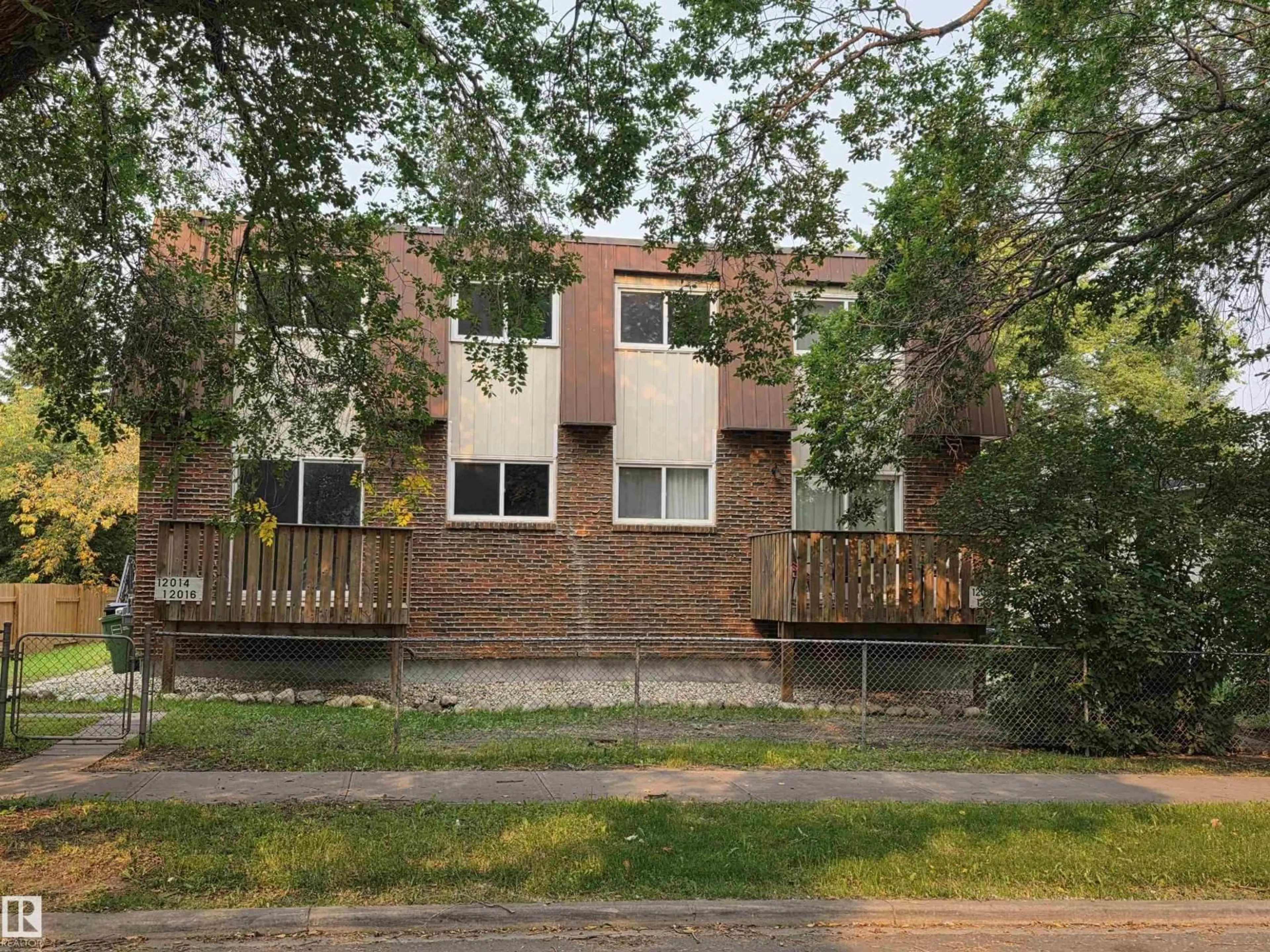 Home with brick exterior material, street for NW - 12014-12018A 69 ST, Edmonton Alberta T5B1S6