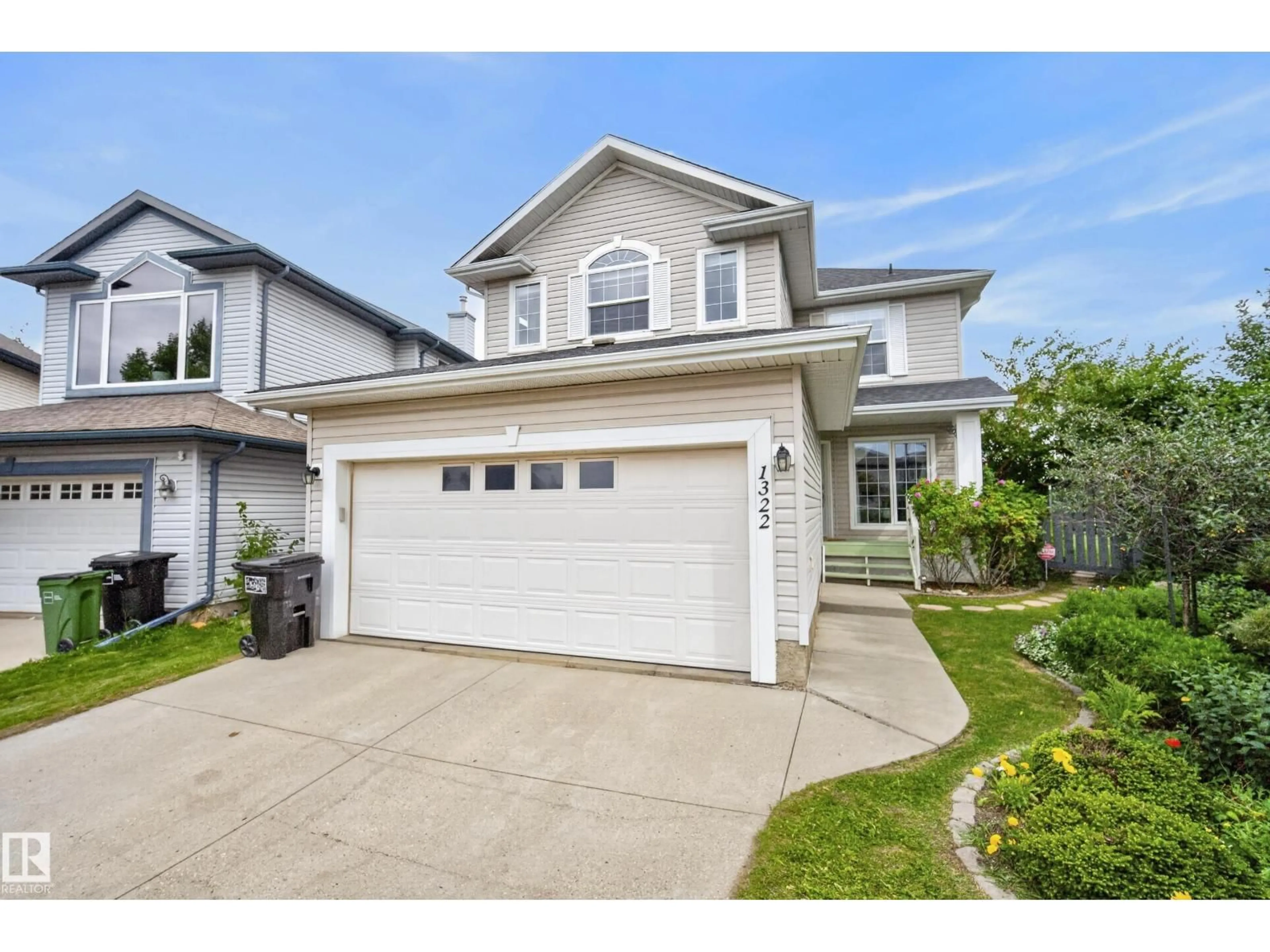 Home with vinyl exterior material, street for 1322 BARNES CL, Edmonton Alberta T6W1G6