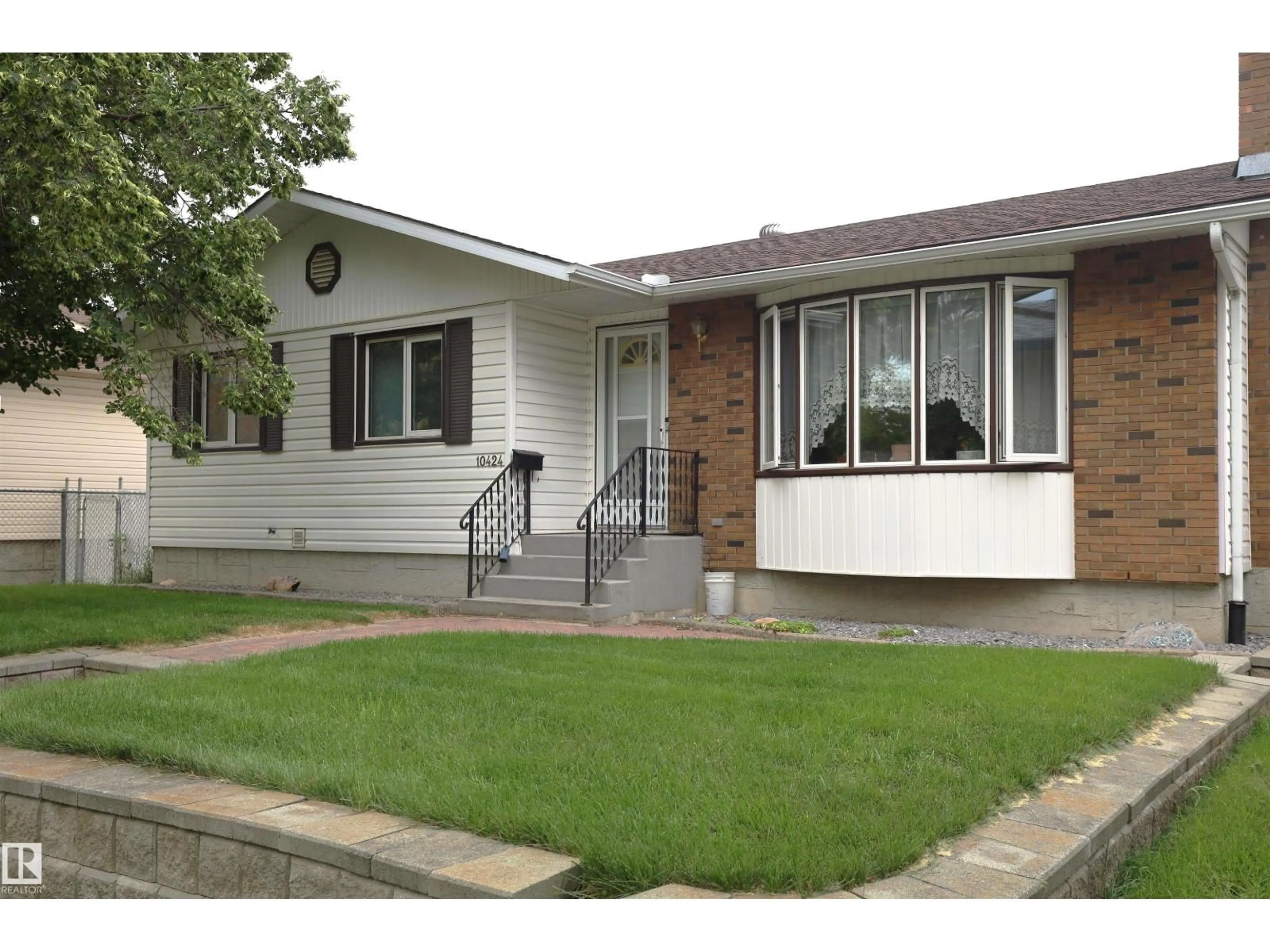 Home with vinyl exterior material, street for NW - 10424 152 ST, Edmonton Alberta T5P1Y6