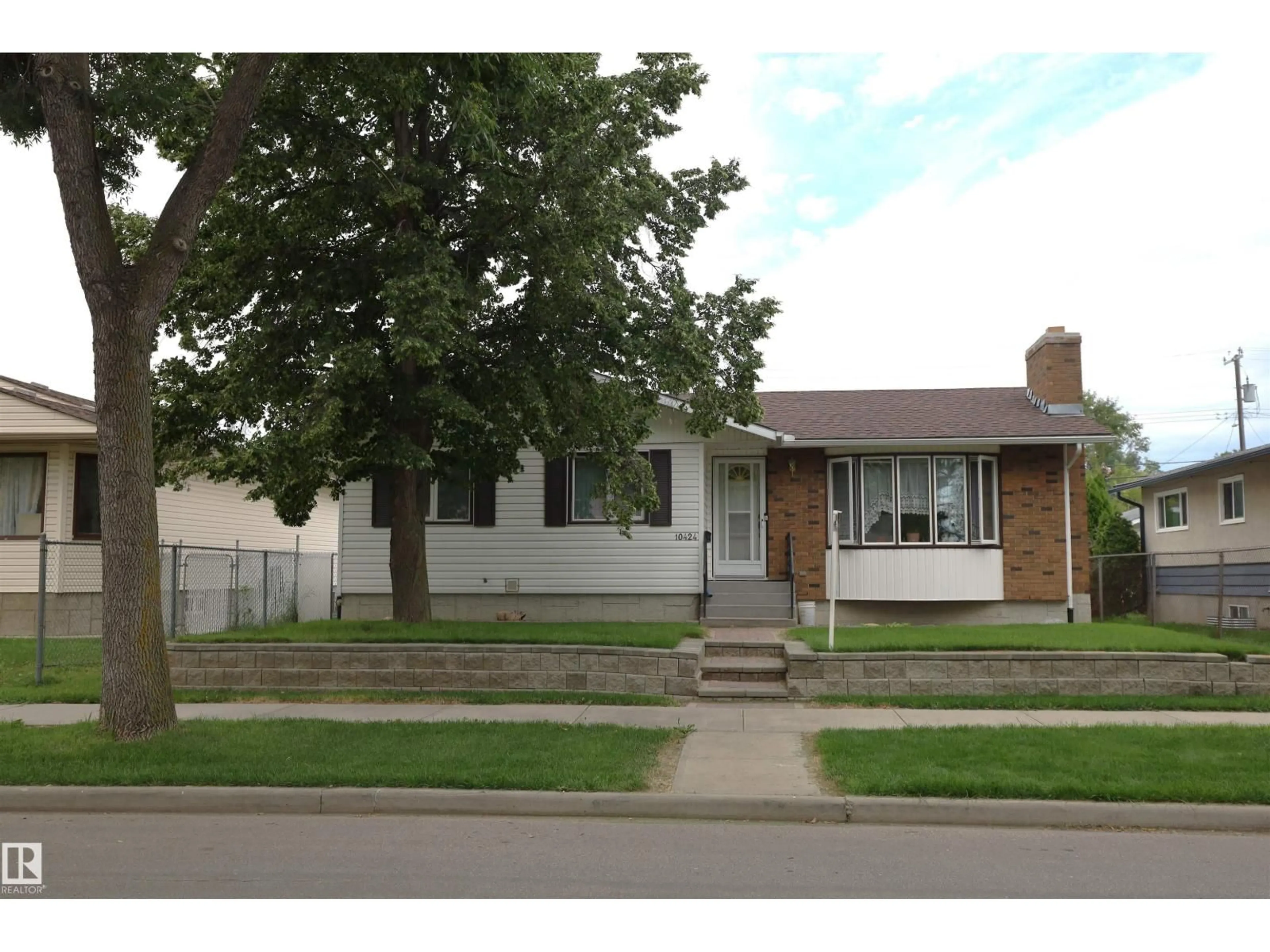 Home with brick exterior material, street for NW - 10424 152 ST, Edmonton Alberta T5P1Y6