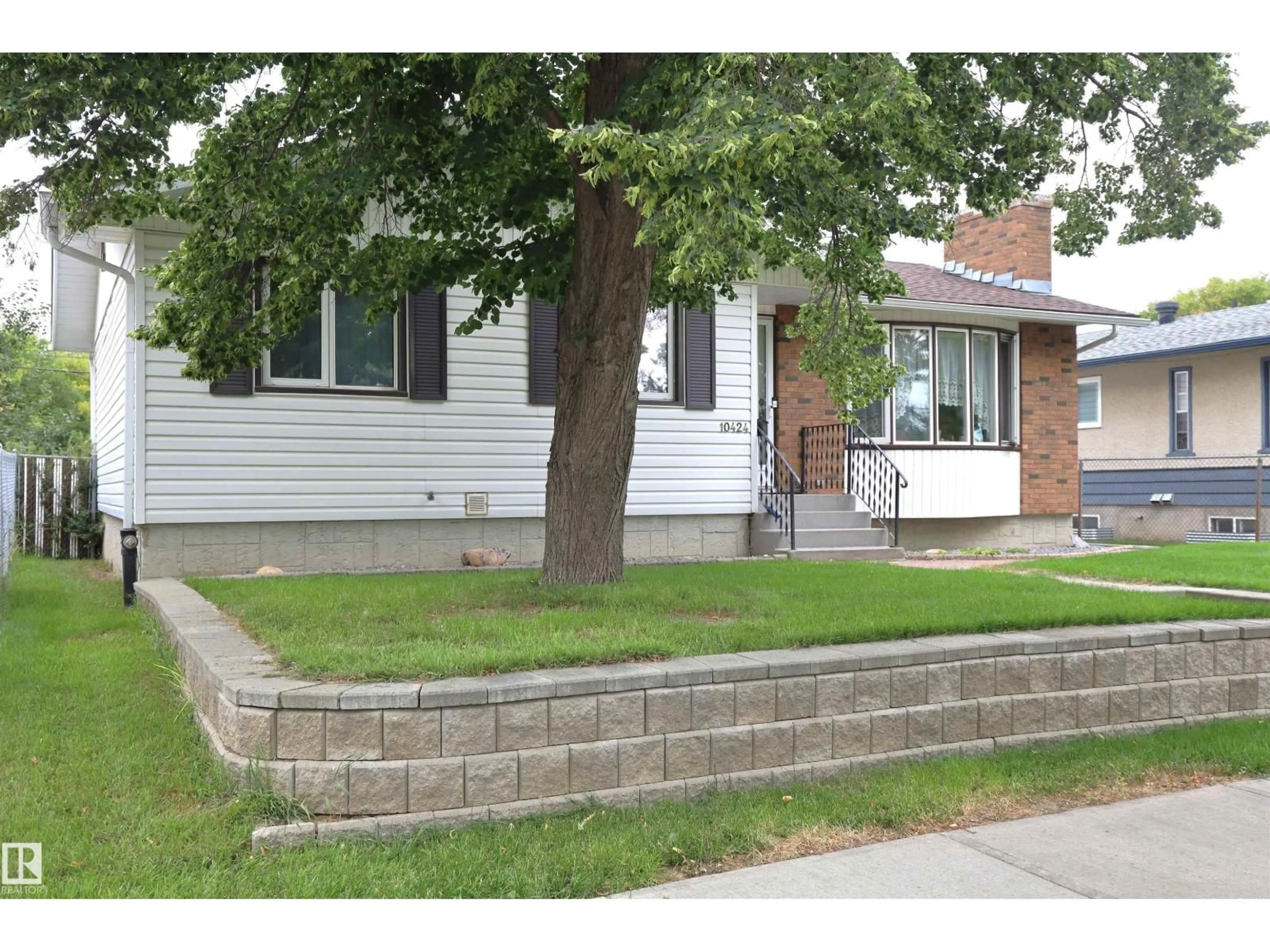 Home with brick exterior material, street for NW - 10424 152 ST, Edmonton Alberta T5P1Y6