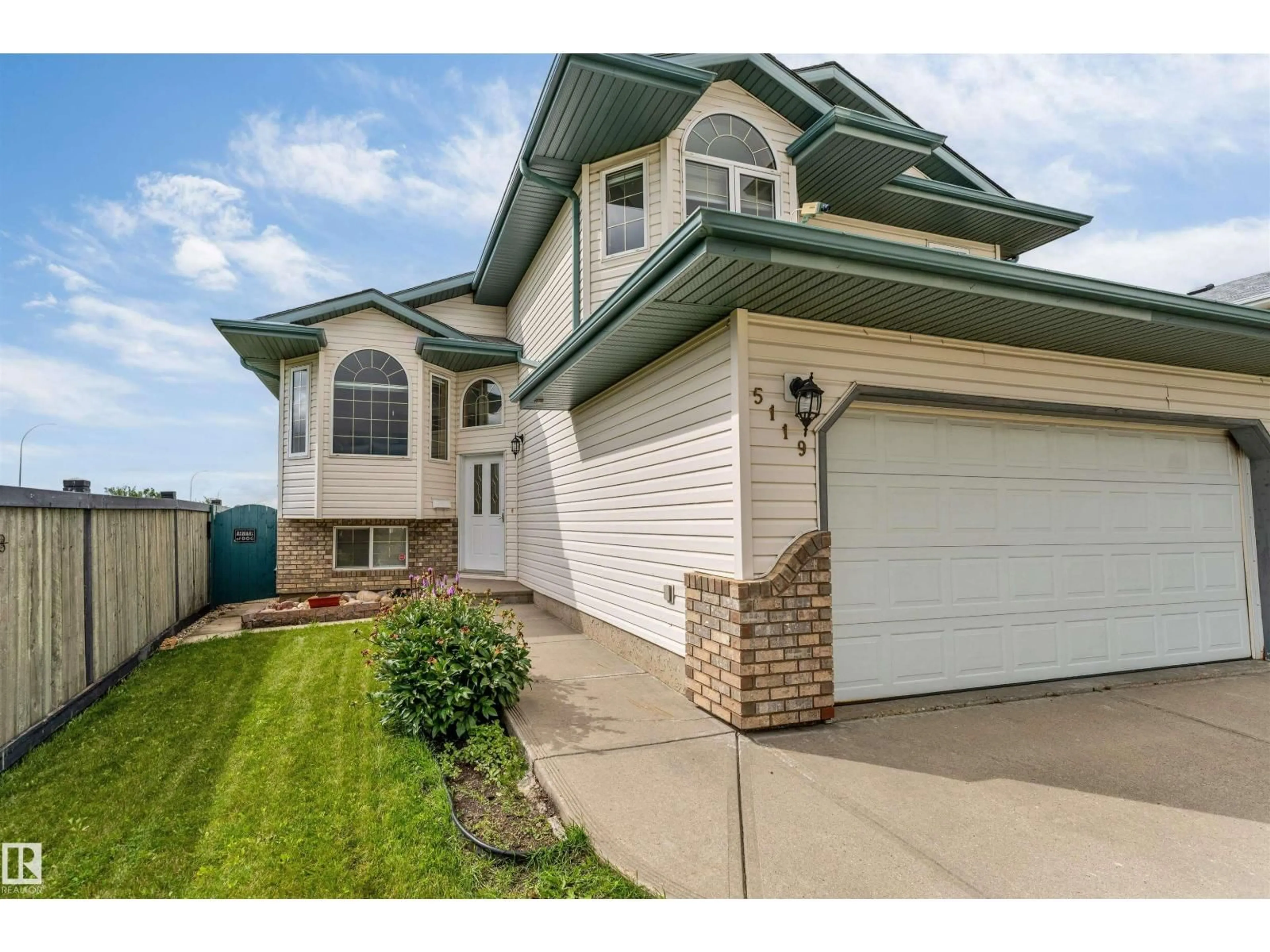 Home with vinyl exterior material, street for NW - 5119 157 AV, Edmonton Alberta T5Y2X5