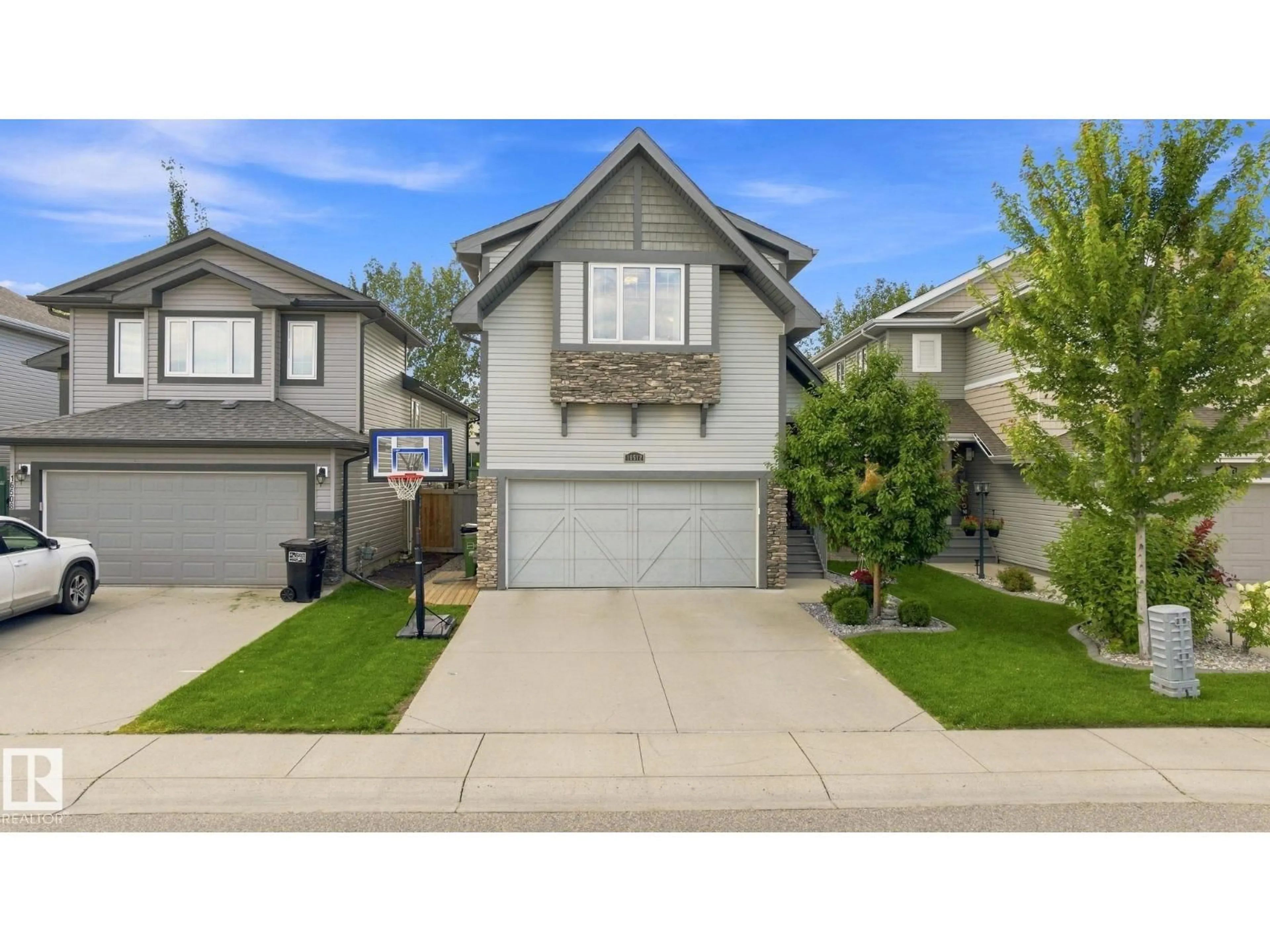 Home with vinyl exterior material, street for NW - 16512 140 ST, Edmonton Alberta T6V0K7