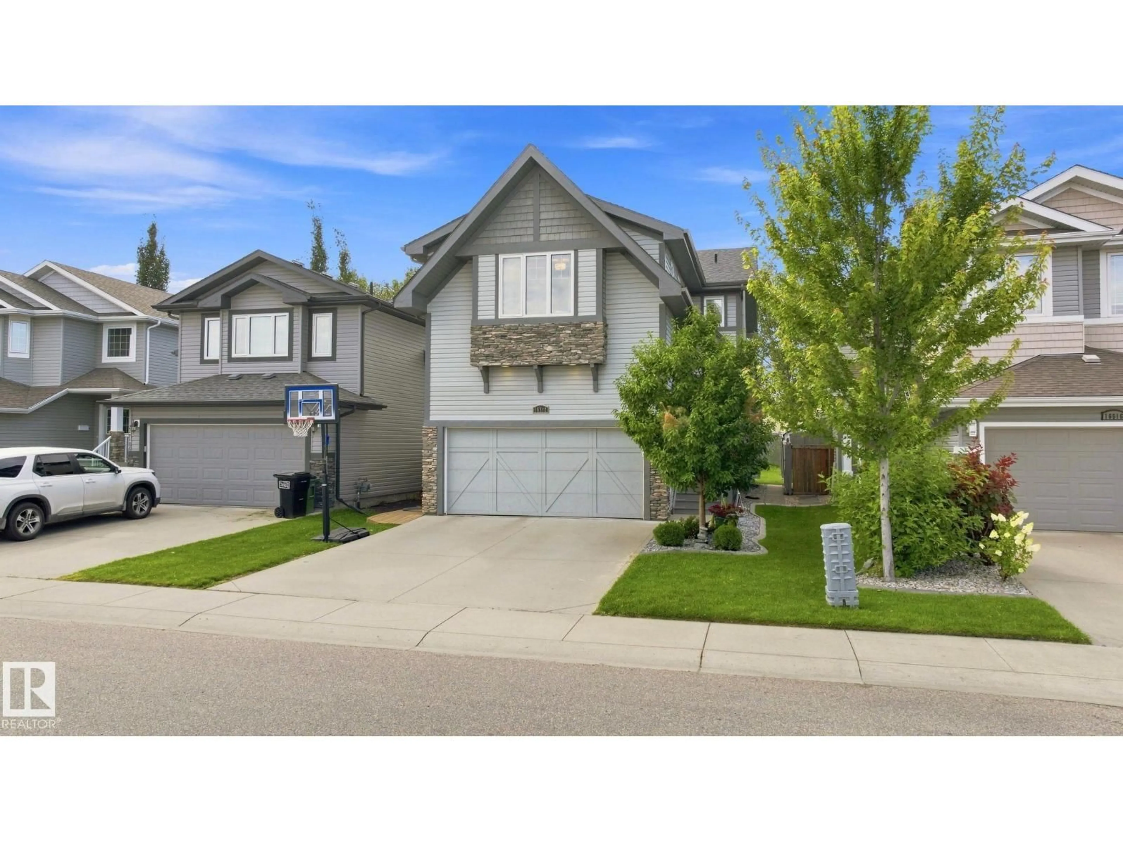Home with vinyl exterior material, street for NW - 16512 140 ST, Edmonton Alberta T6V0K7