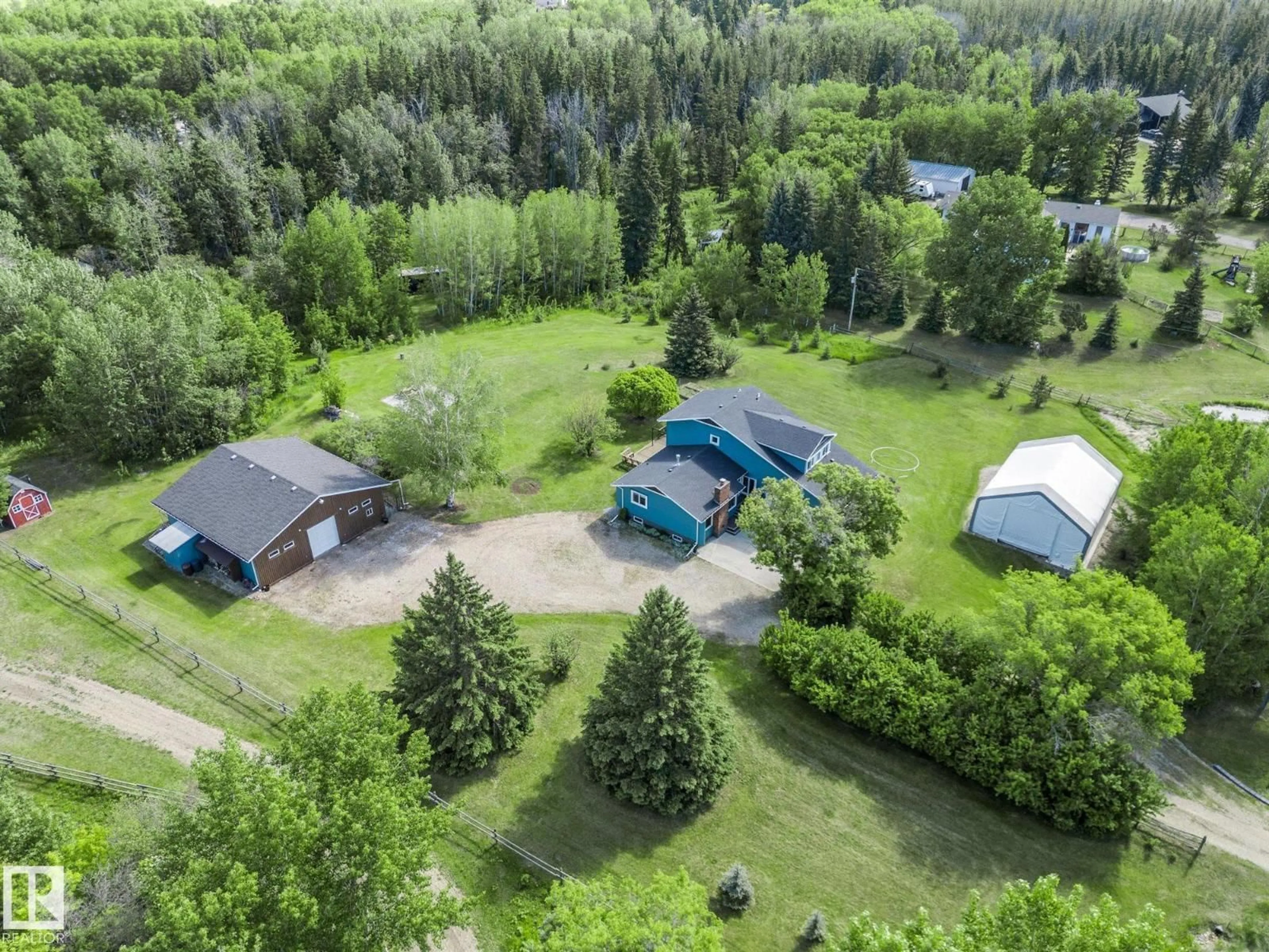 A pic from outside/outdoor area/front of a property/back of a property/a pic from drone, forest/trees view for 17 - 27208 TWP ROAD 534, Rural Parkland County Alberta T7X3N2