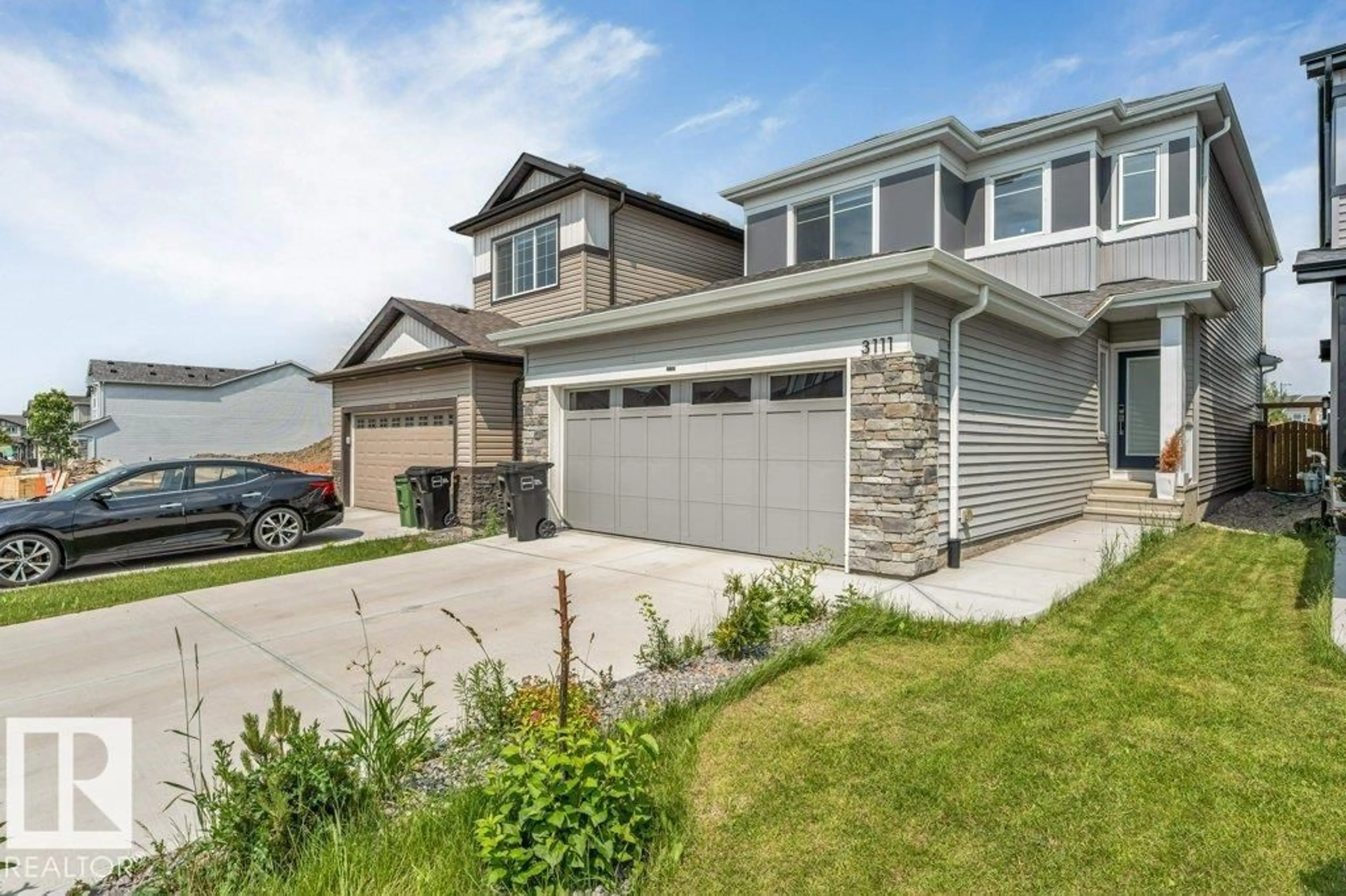 Home with vinyl exterior material, street for 3111 9 ST, Edmonton Alberta T6T2V6