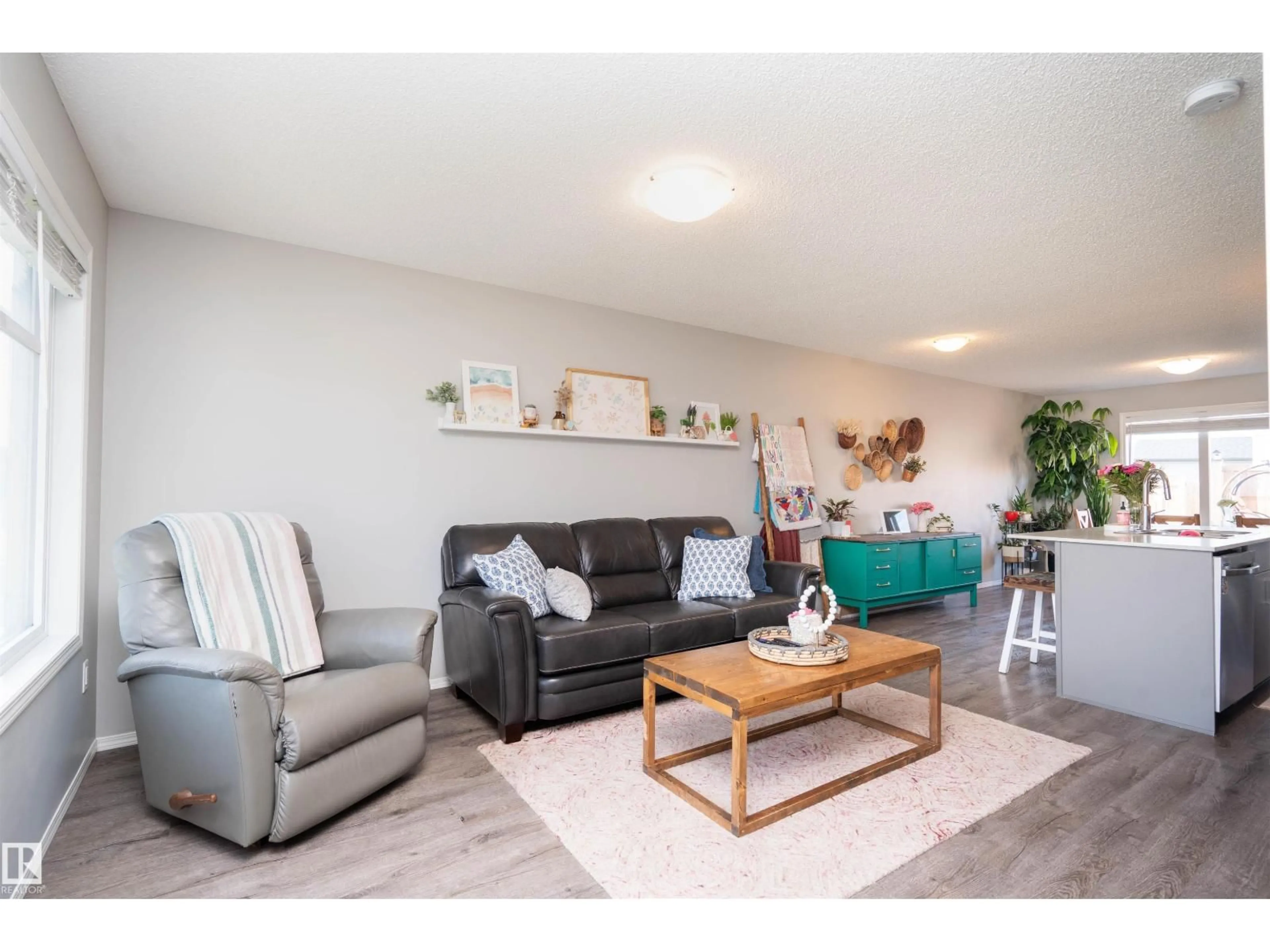 Living room with furniture, wood/laminate floor for 3040 CHECKNITA WY, Edmonton Alberta T6W3X8