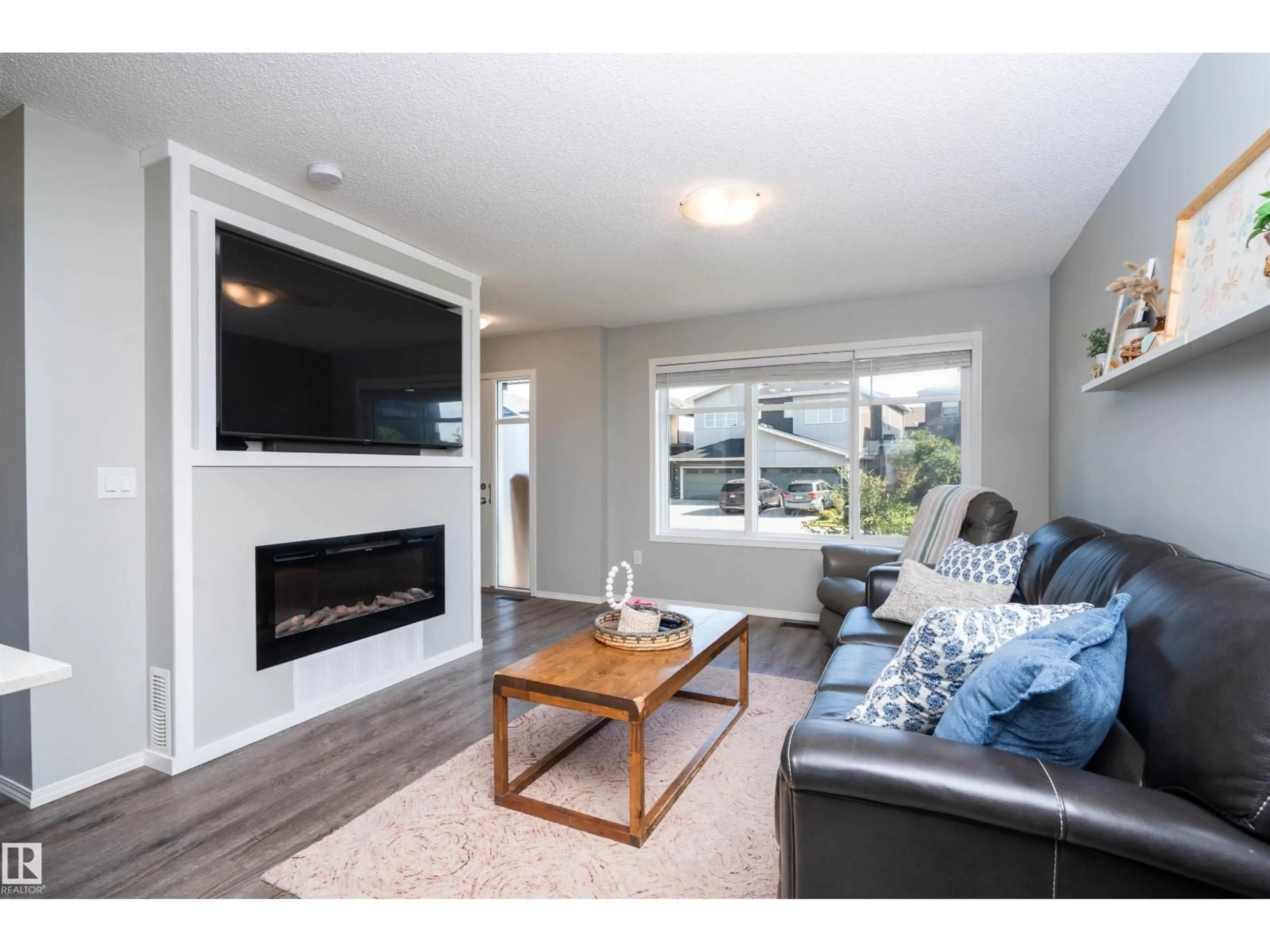 Living room with furniture, wood/laminate floor for 3040 CHECKNITA WY, Edmonton Alberta T6W3X8