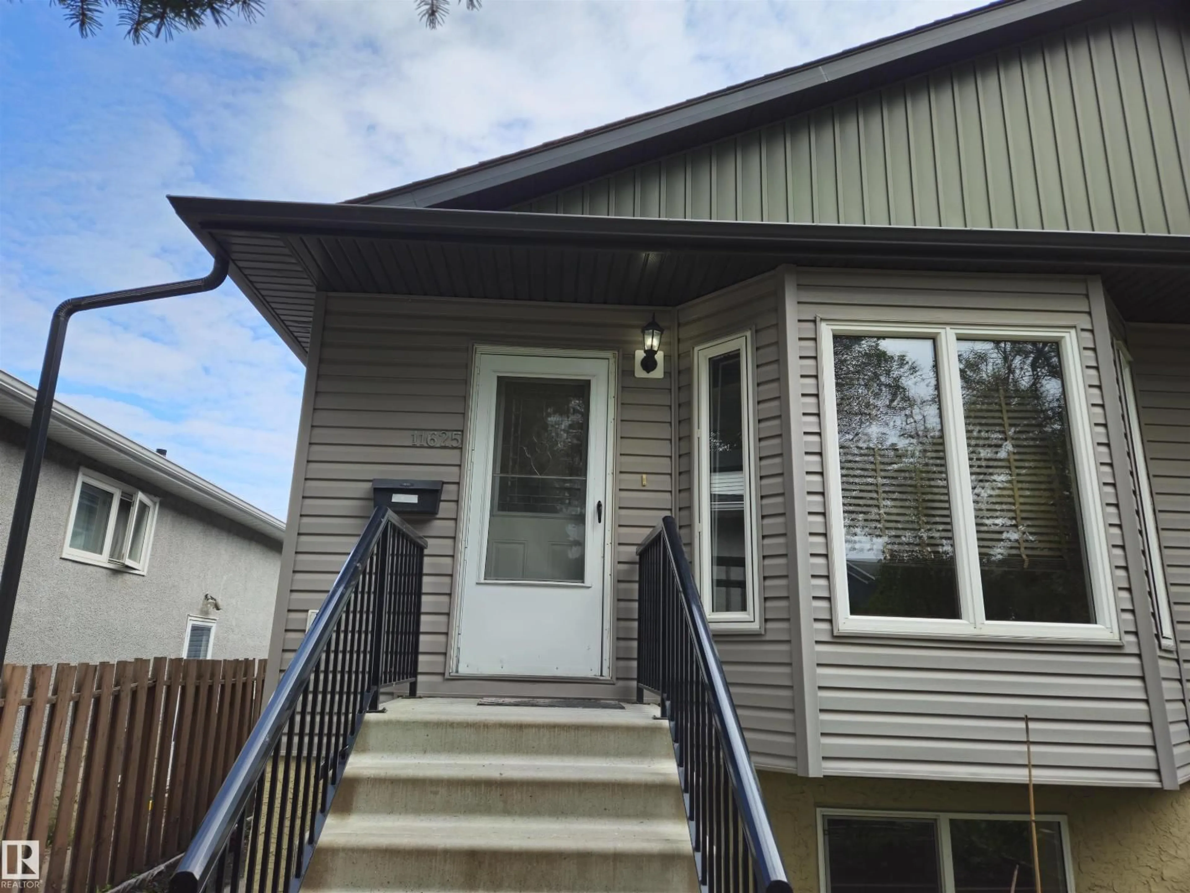 Home with vinyl exterior material, street for 11625 88 ST, Edmonton Alberta T5B3R5
