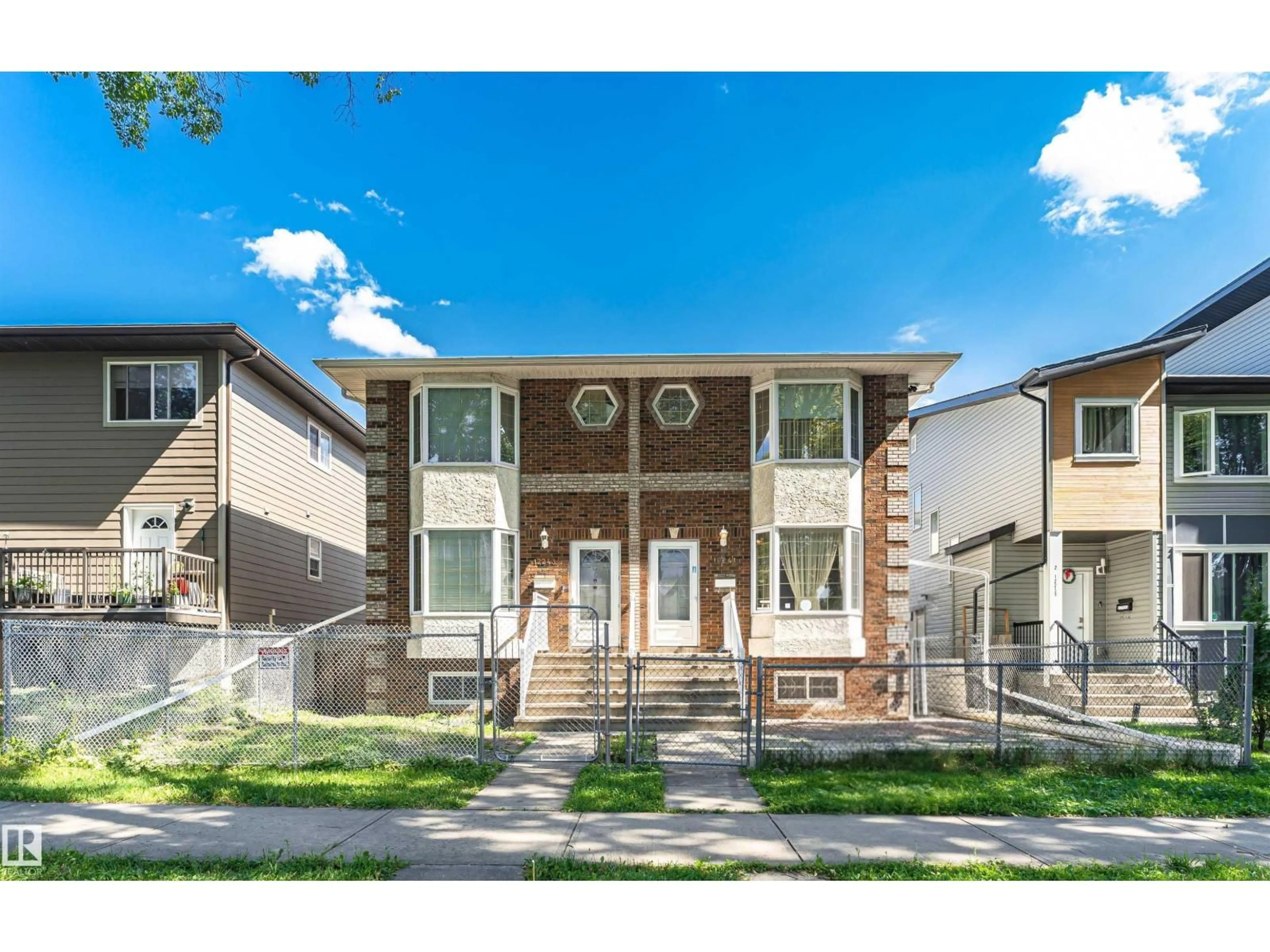 Home with vinyl exterior material, street for 12241 93 ST, Edmonton Alberta T5G1G2
