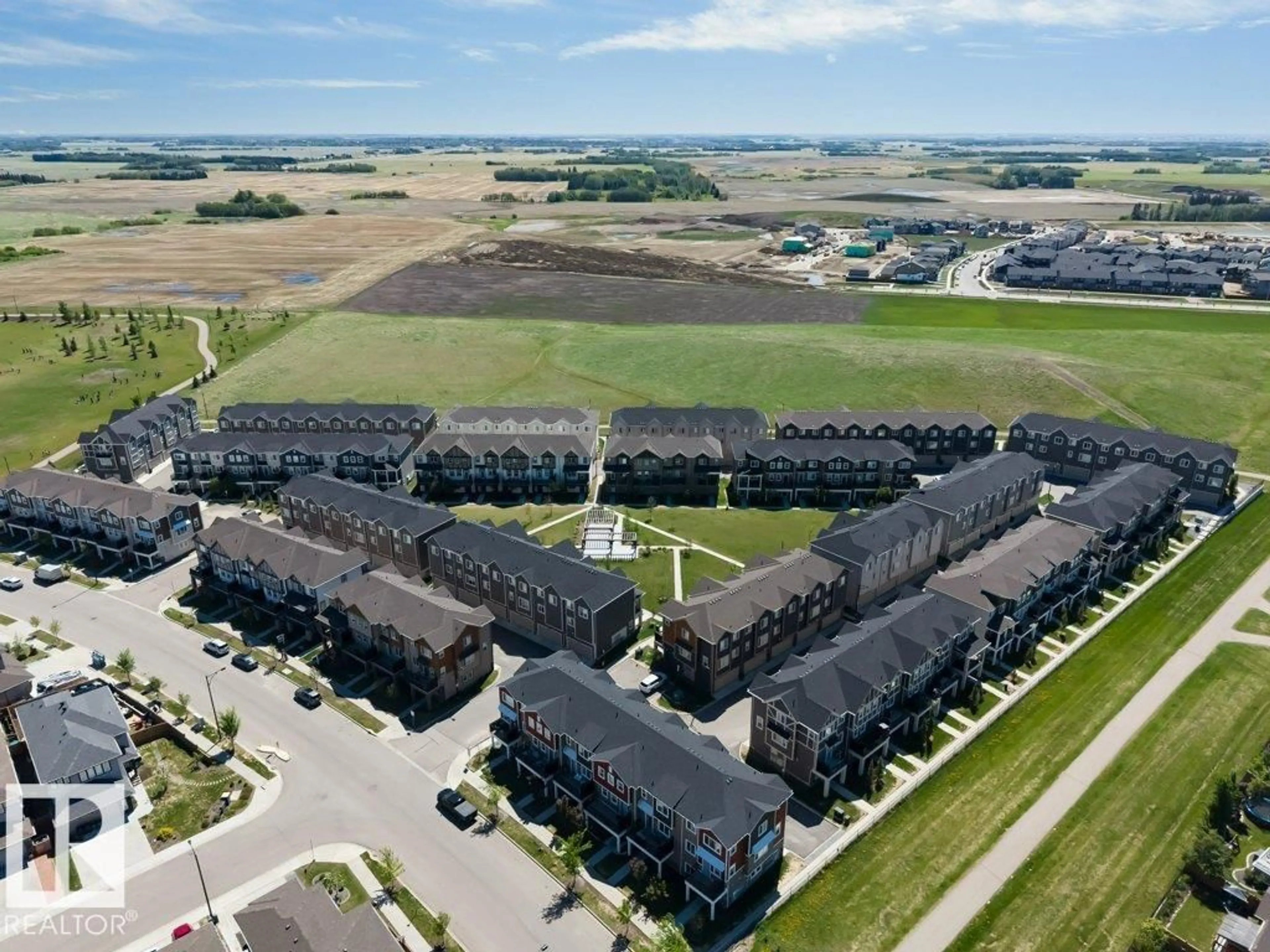 A pic from outside/outdoor area/front of a property/back of a property/a pic from drone, unknown for #105 - 2072 WONNACOTT WY, Edmonton Alberta T6X2V7