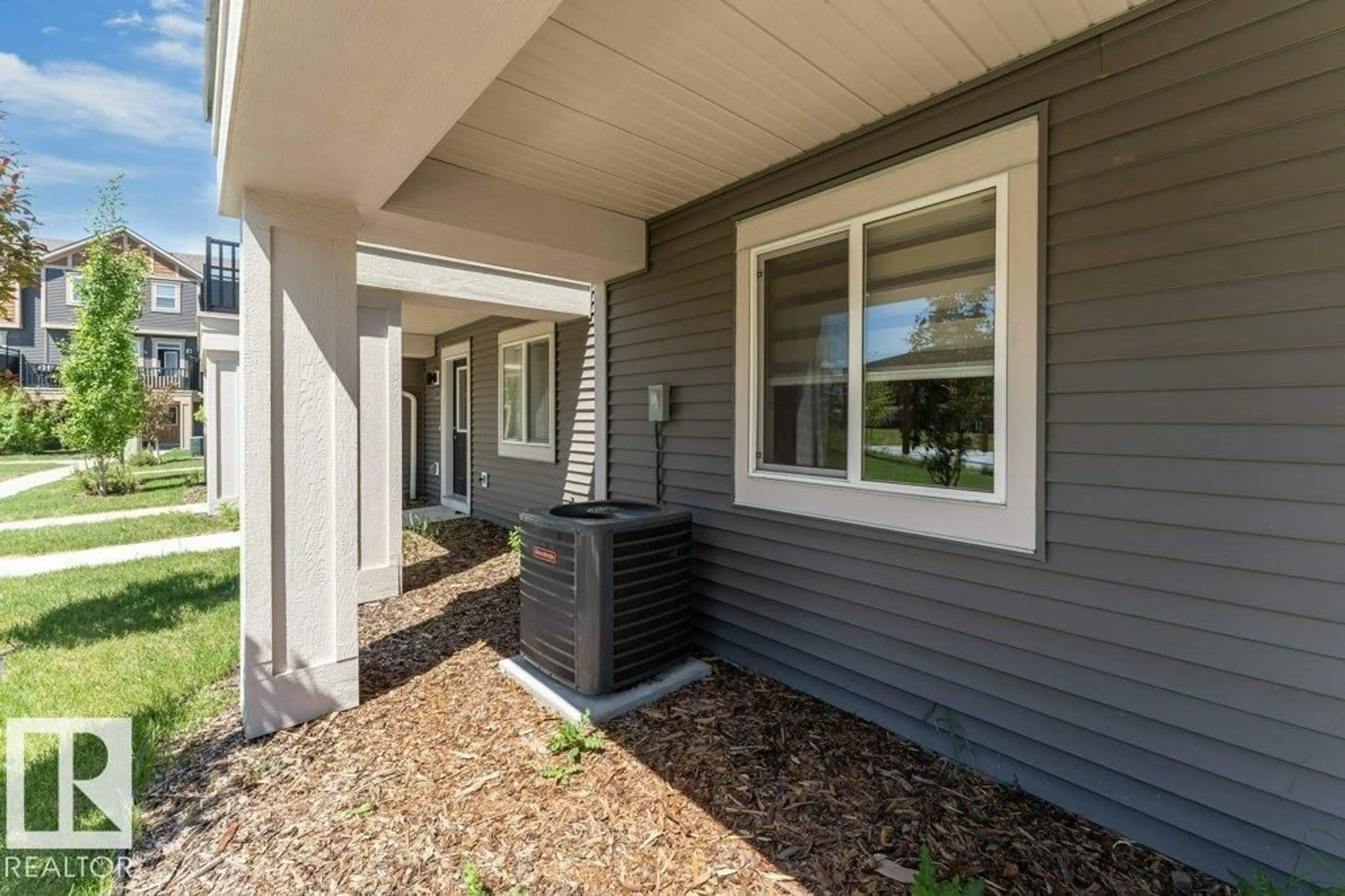 Home with vinyl exterior material, street for #105 - 2072 WONNACOTT WY, Edmonton Alberta T6X2V7