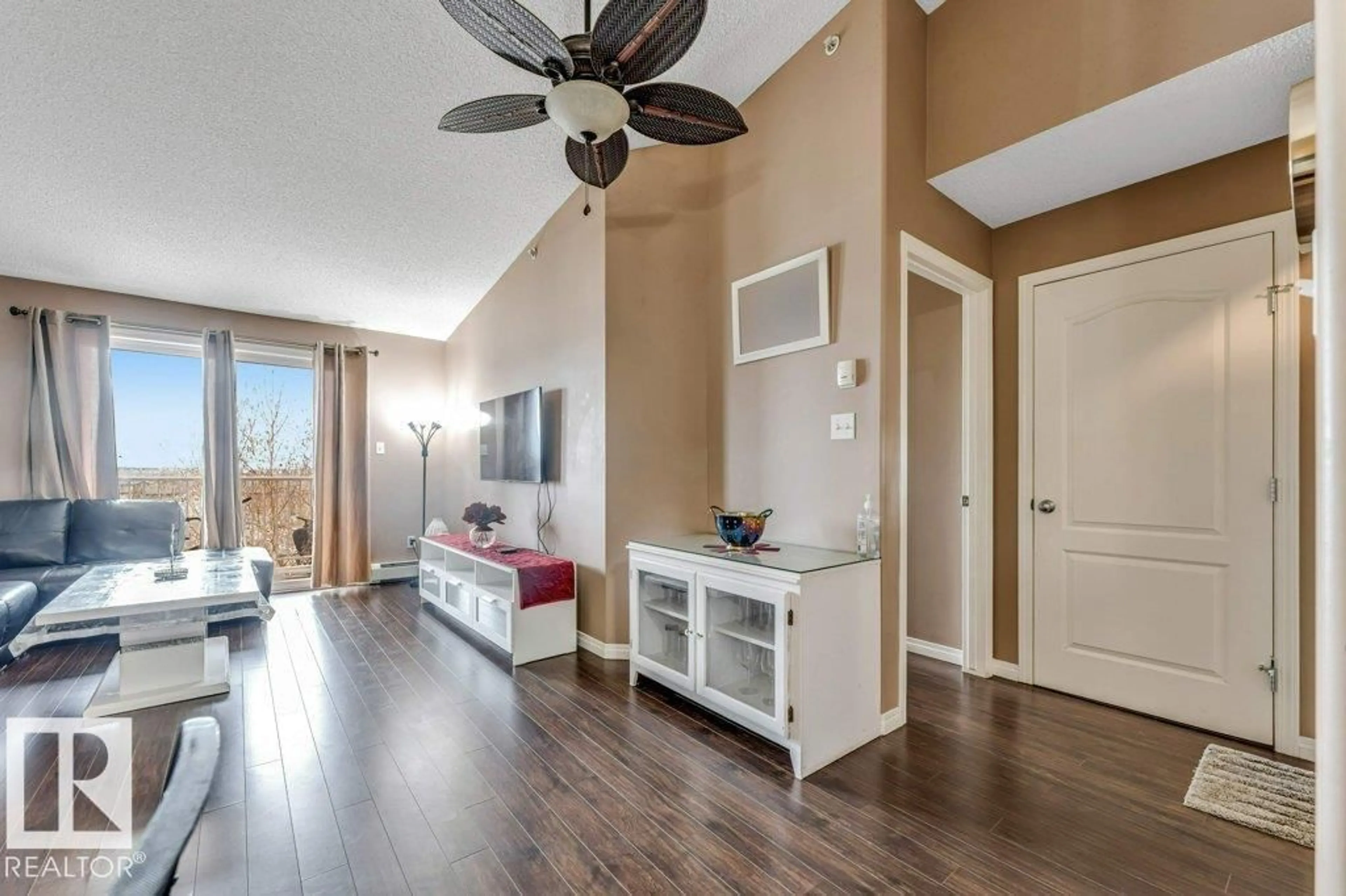 Living room with furniture, wood/laminate floor for #404 - 3425 19 ST, Edmonton Alberta T6T2B5