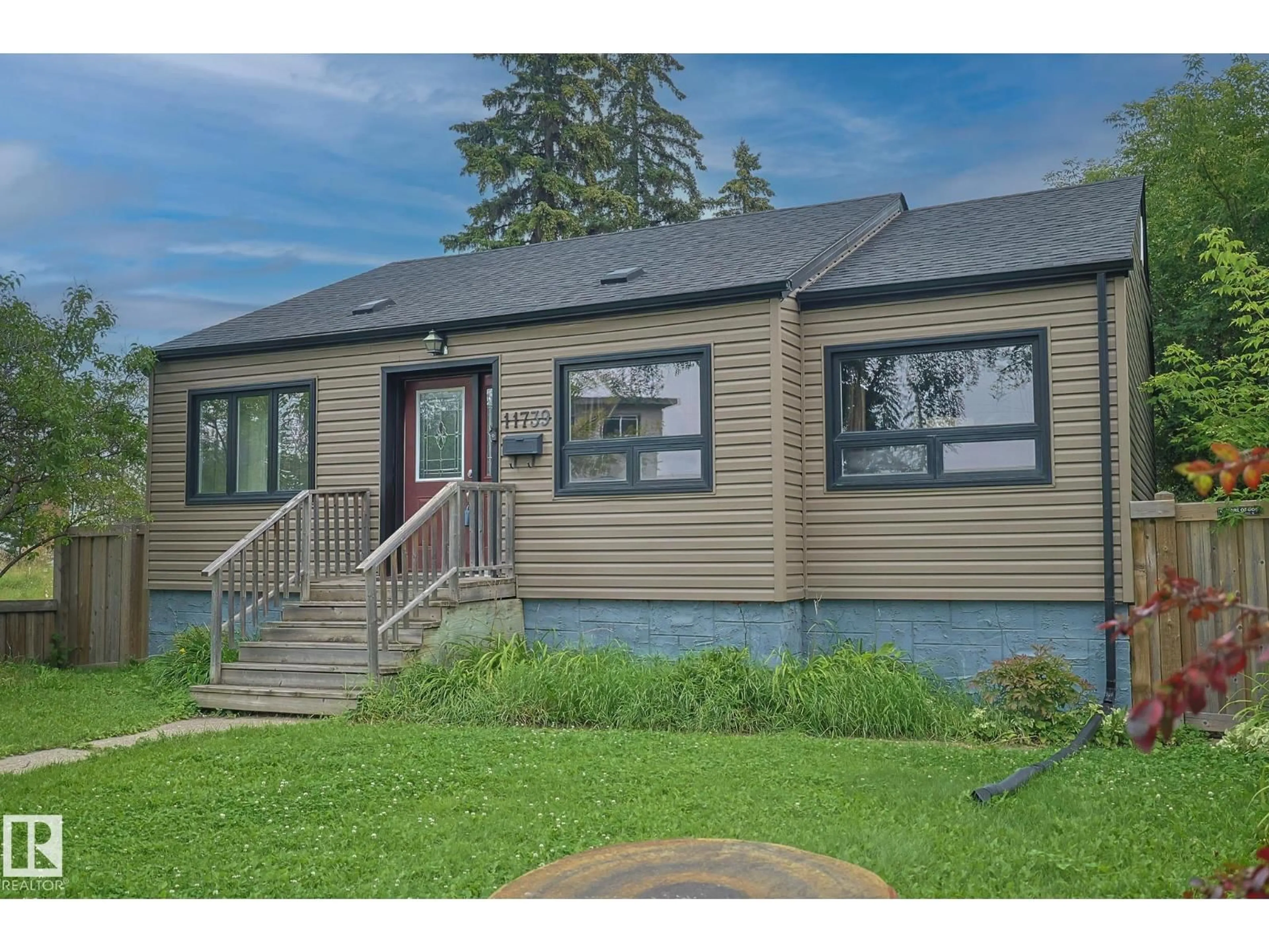 Home with vinyl exterior material, street for 11739 129 ST, Edmonton Alberta T5M0Y8