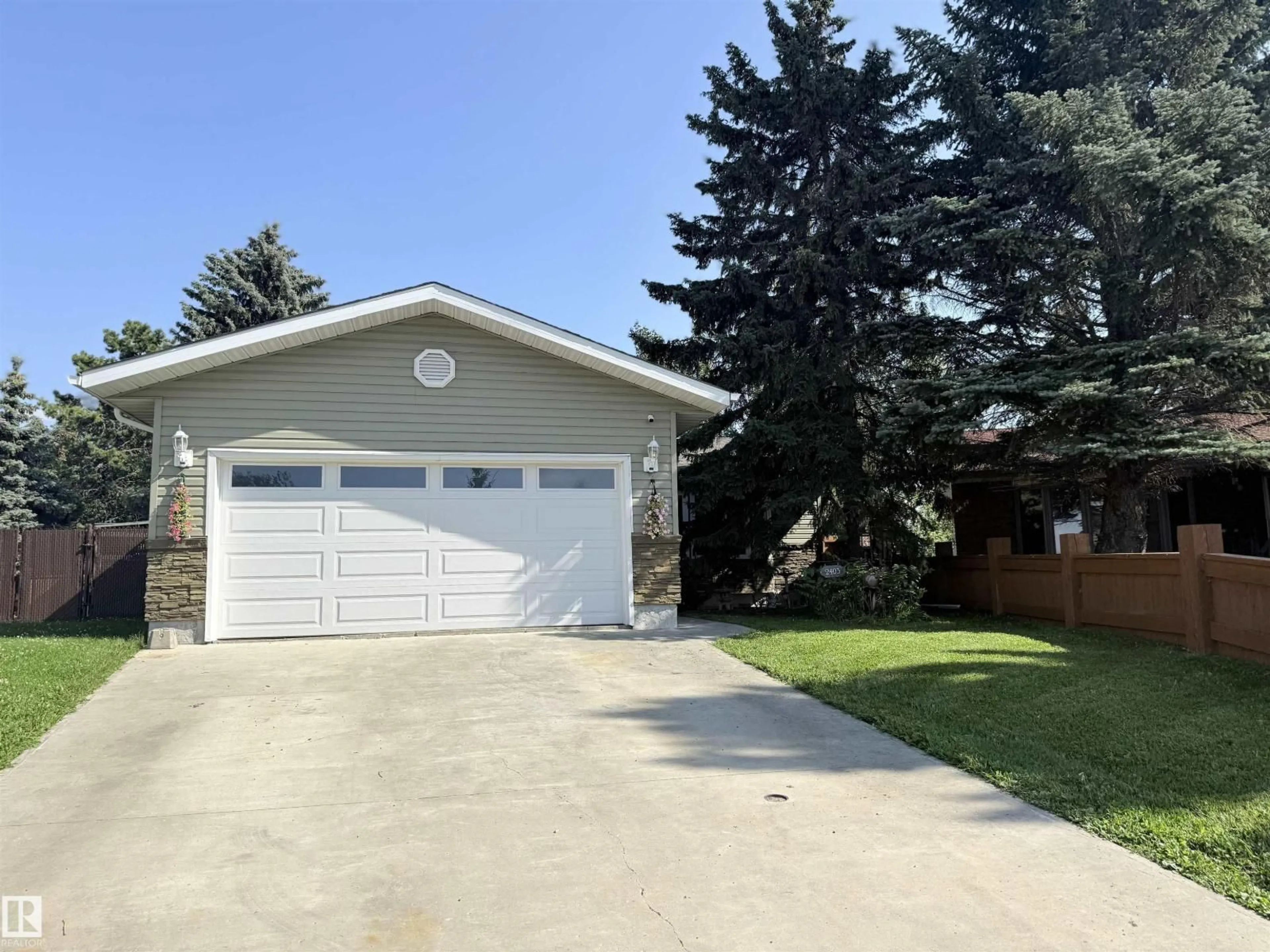 Home with vinyl exterior material, street for 2403 81 ST, Edmonton Alberta T6K3L5