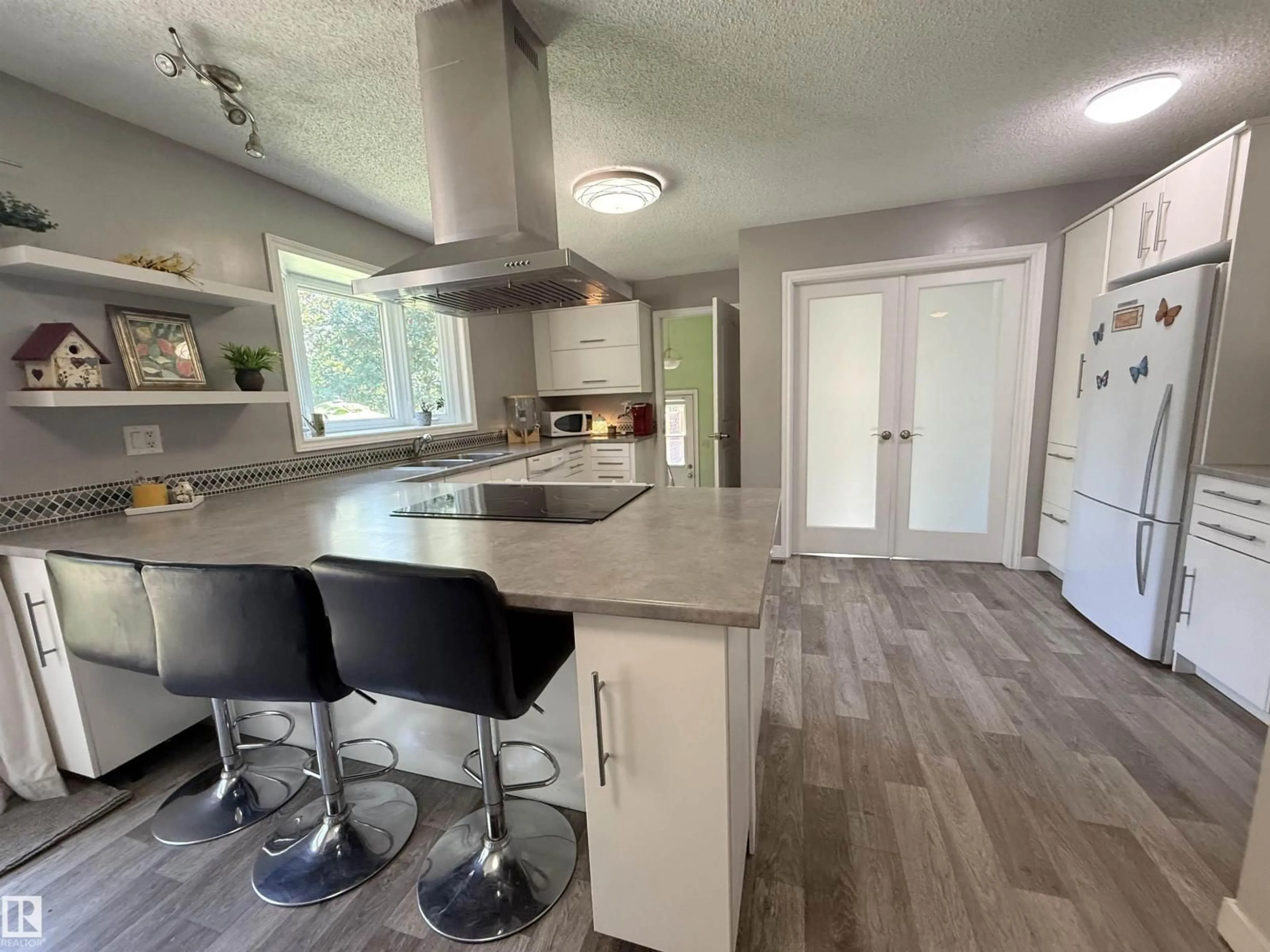 Open concept kitchen, unknown for 2403 81 ST, Edmonton Alberta T6K3L5