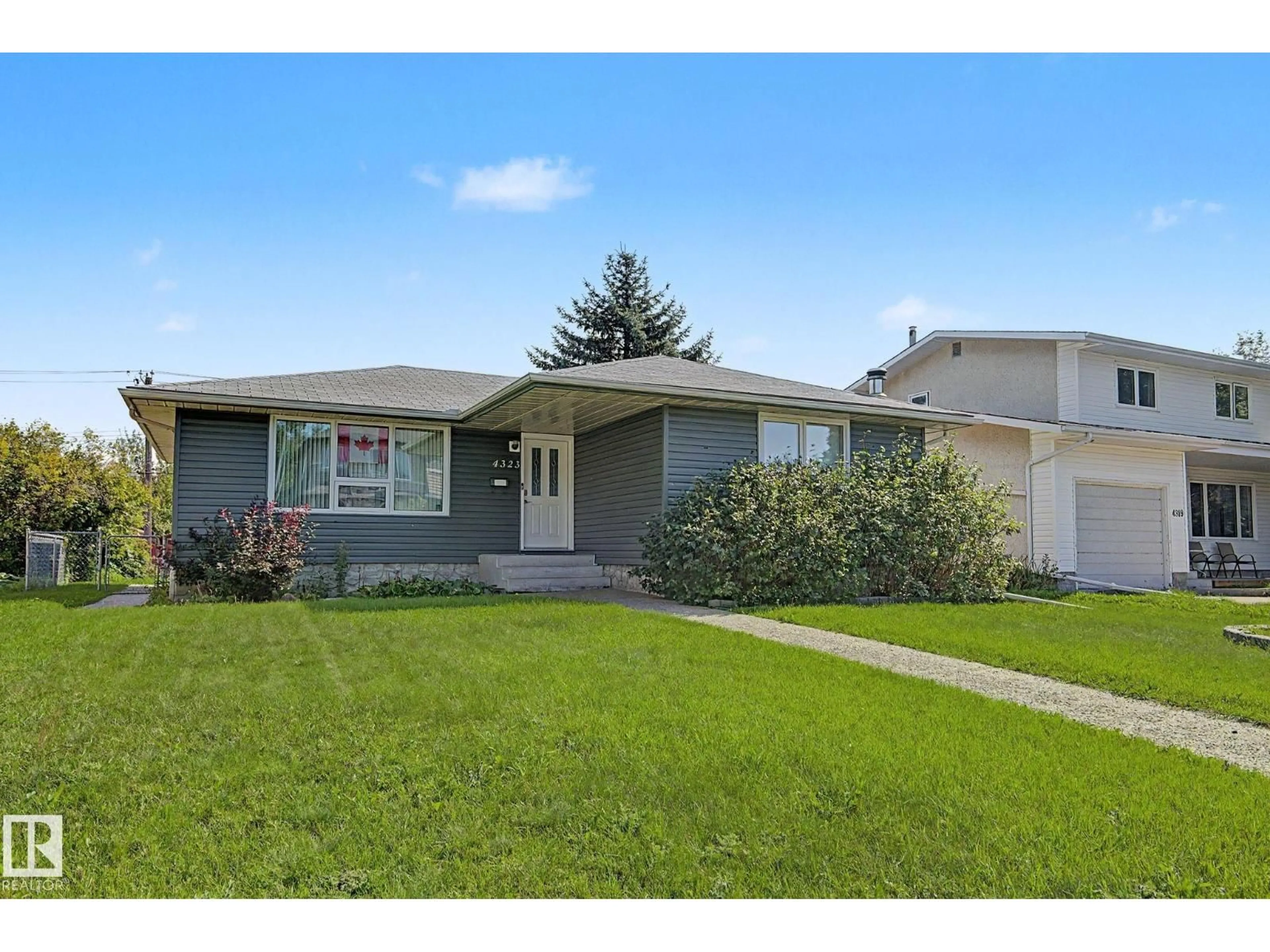 Home with vinyl exterior material, street for NW - 4323 114B ST, Edmonton Alberta T6J1N8