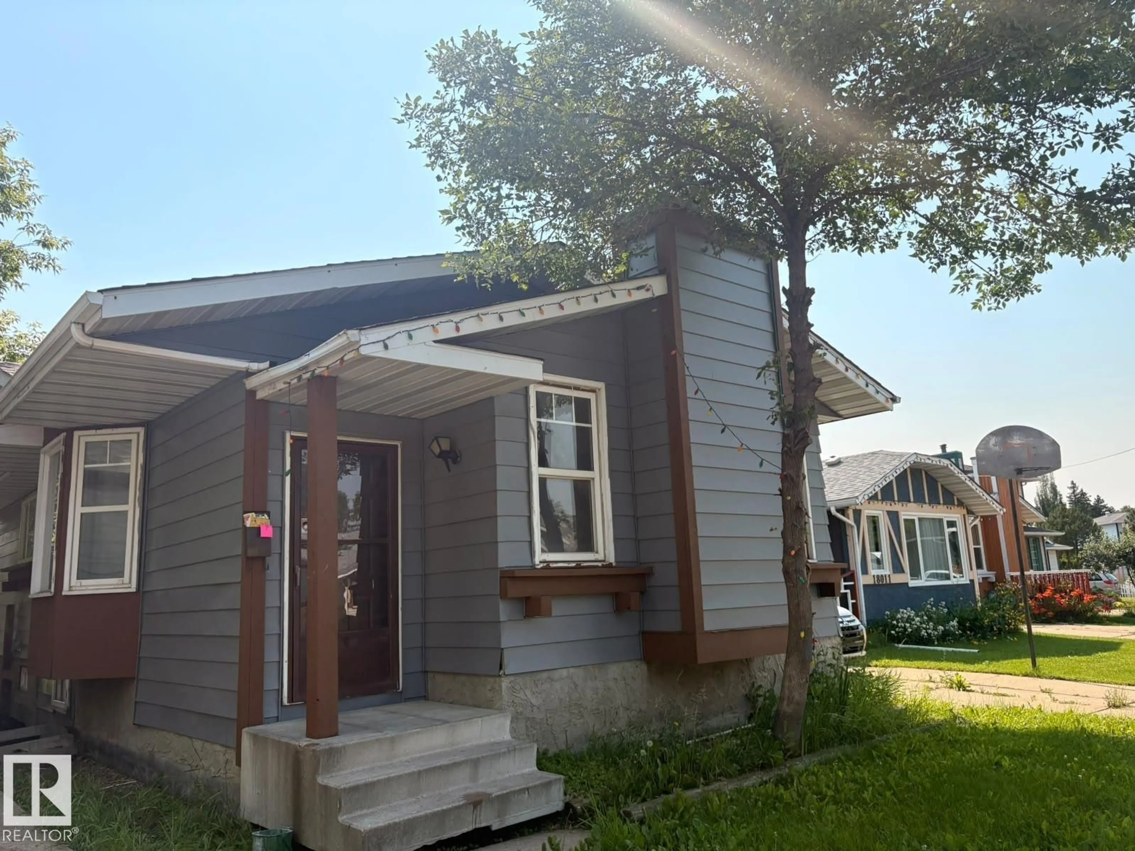 Home with vinyl exterior material, street for 18007 73 AV, Edmonton Alberta T5T3K2