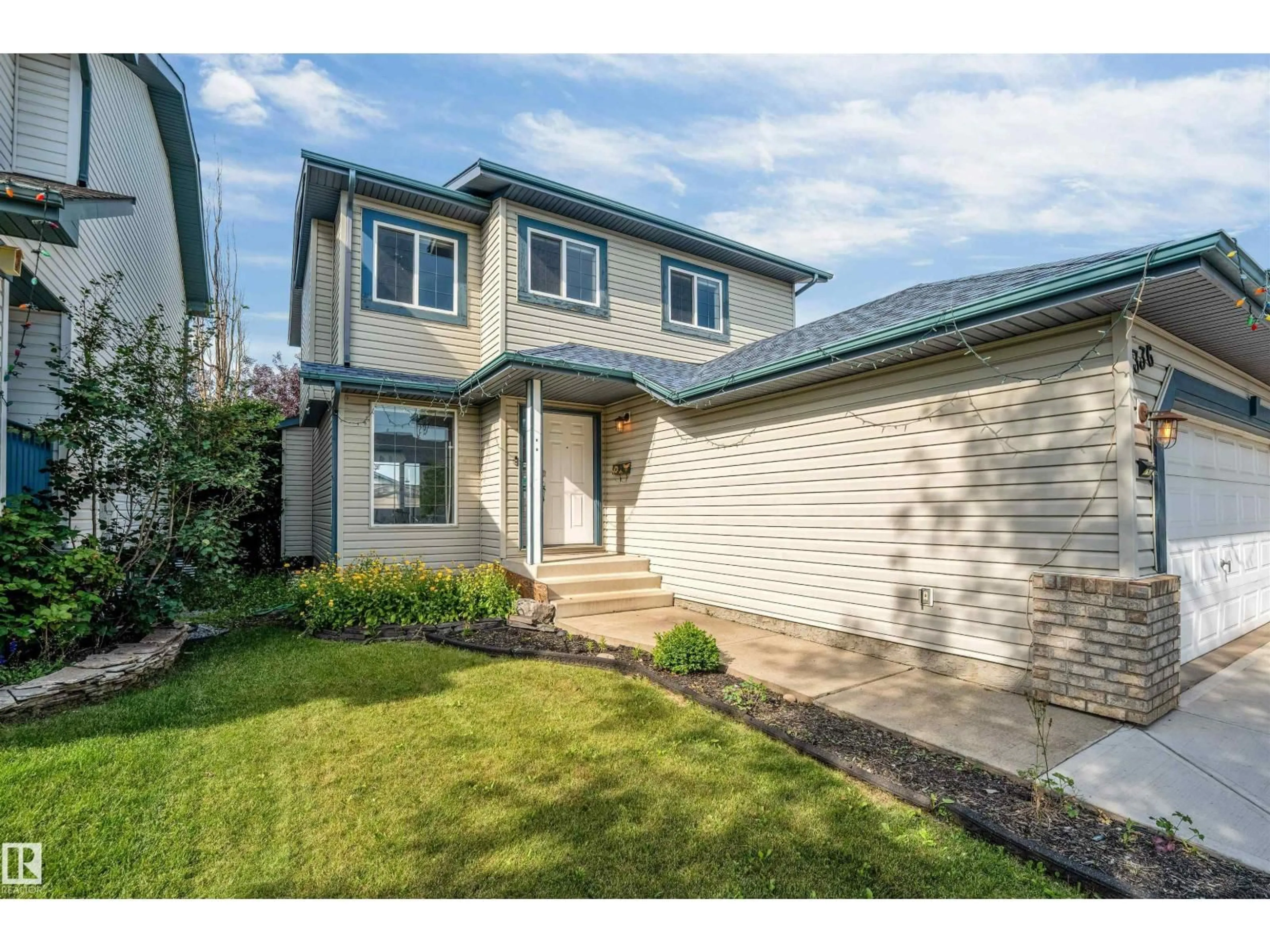 Home with vinyl exterior material, street for 336 WILD ROSE WY, Edmonton Alberta T6T1P3