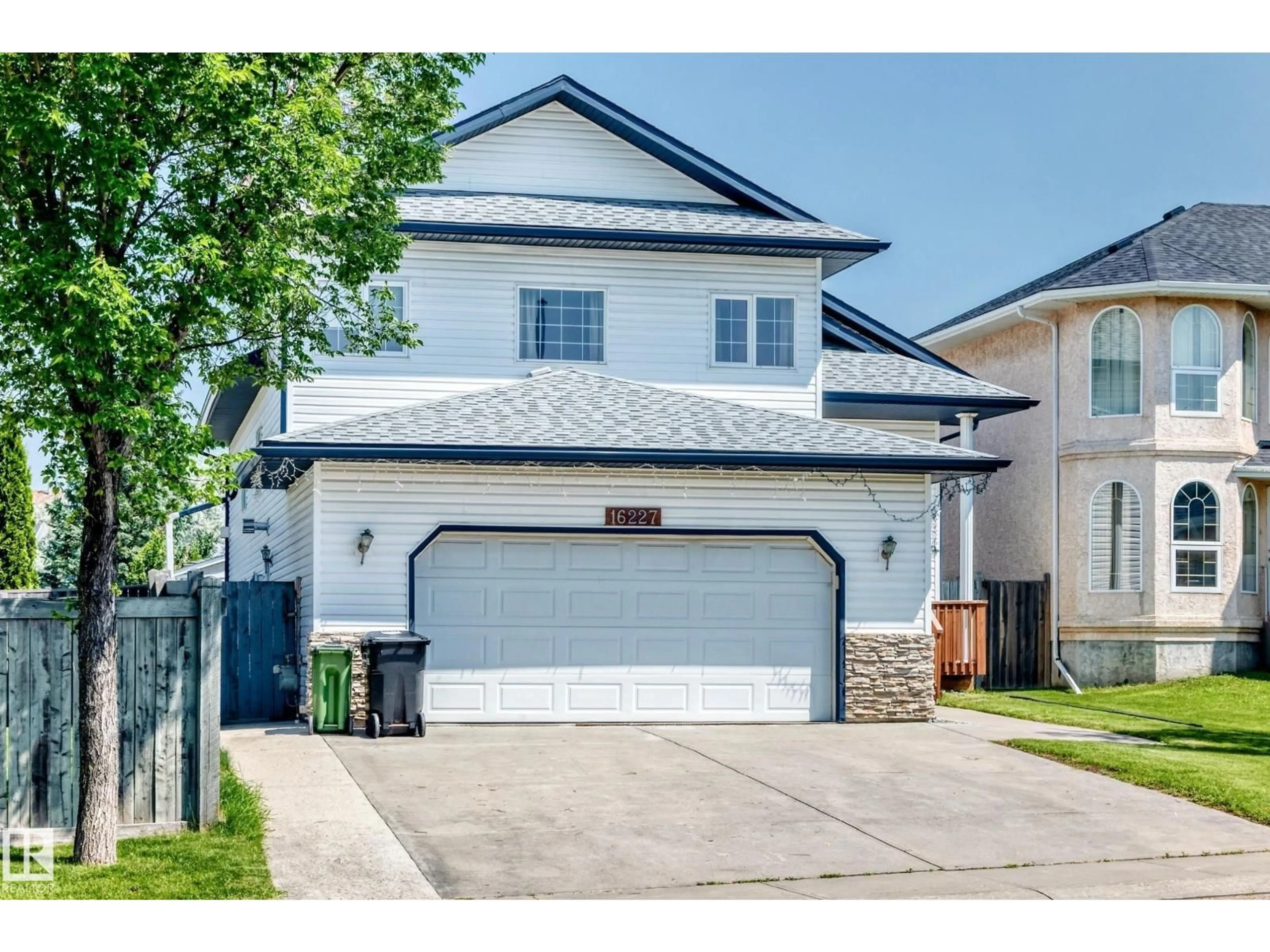 Home with vinyl exterior material, street for NW - 16227 64 ST, Edmonton Alberta T5Y3E2