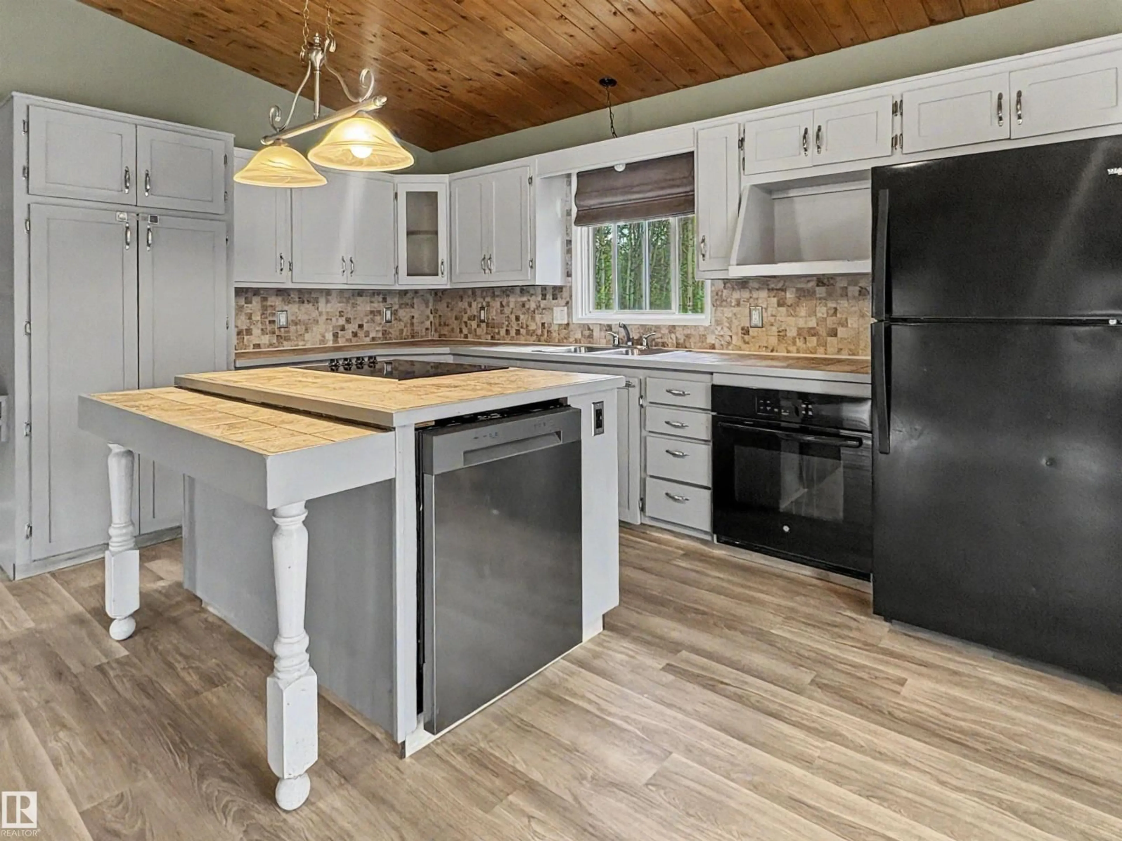 Open concept kitchen, wood/laminate floor for 61209 - 437 RGE RD 465, Rural Bonnyville M.D. Alberta T9N2J6