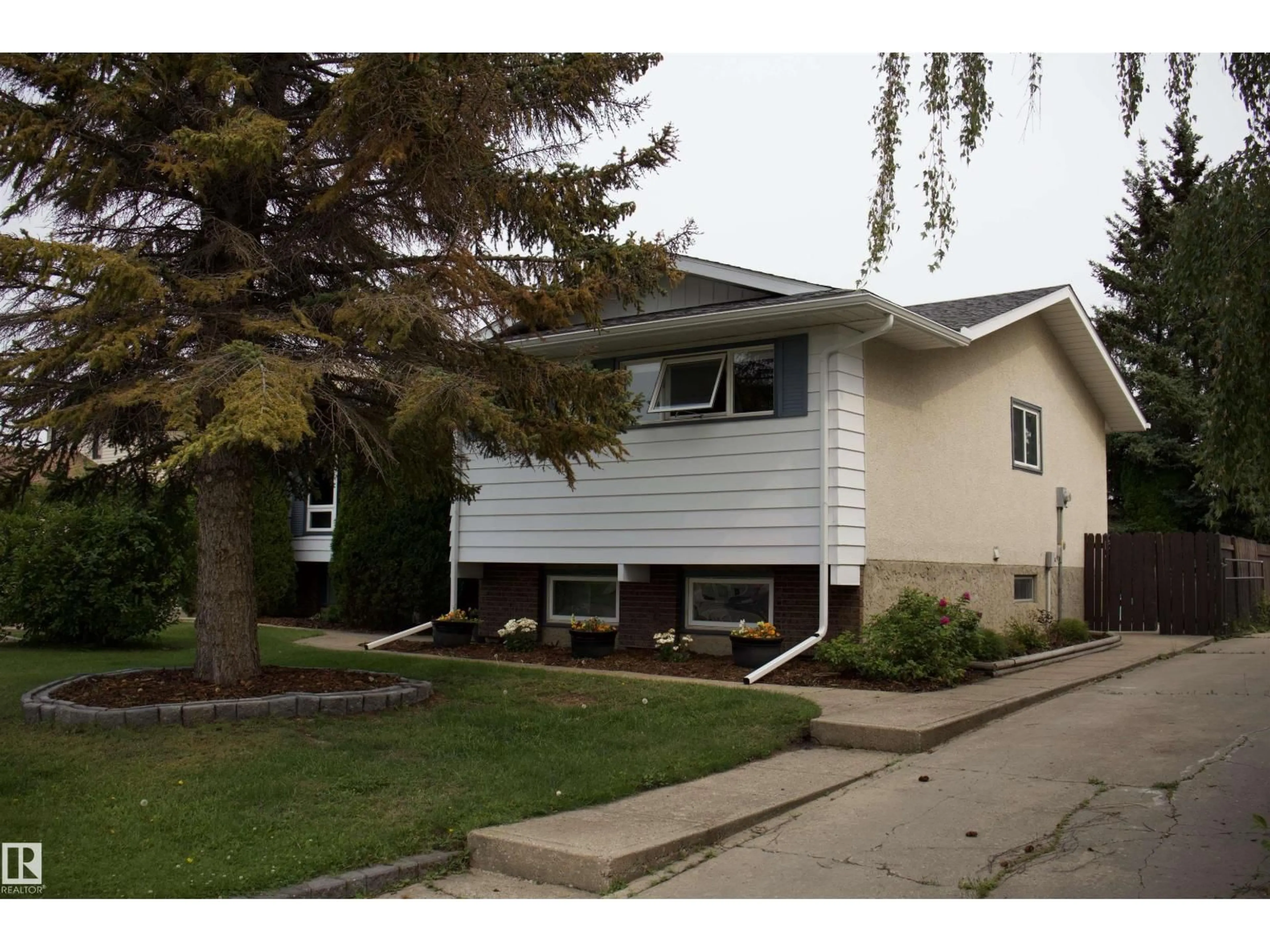 Home with vinyl exterior material, street for 10707 108 AVE, Westlock Alberta T1P1C7