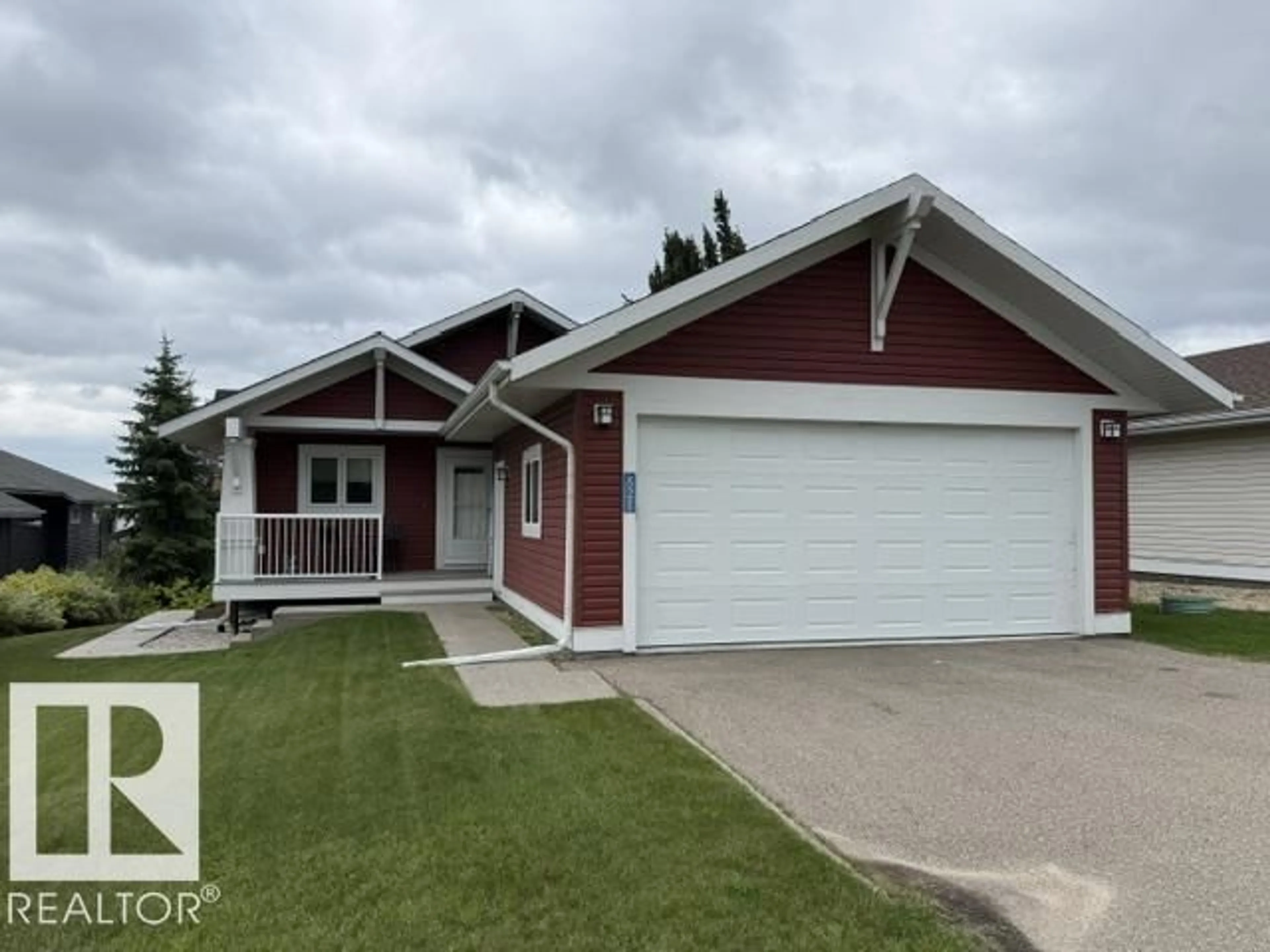 Home with vinyl exterior material, street for 55101 STE. ANNE TR, Rural Lac Ste. Anne County Alberta T0E1A1