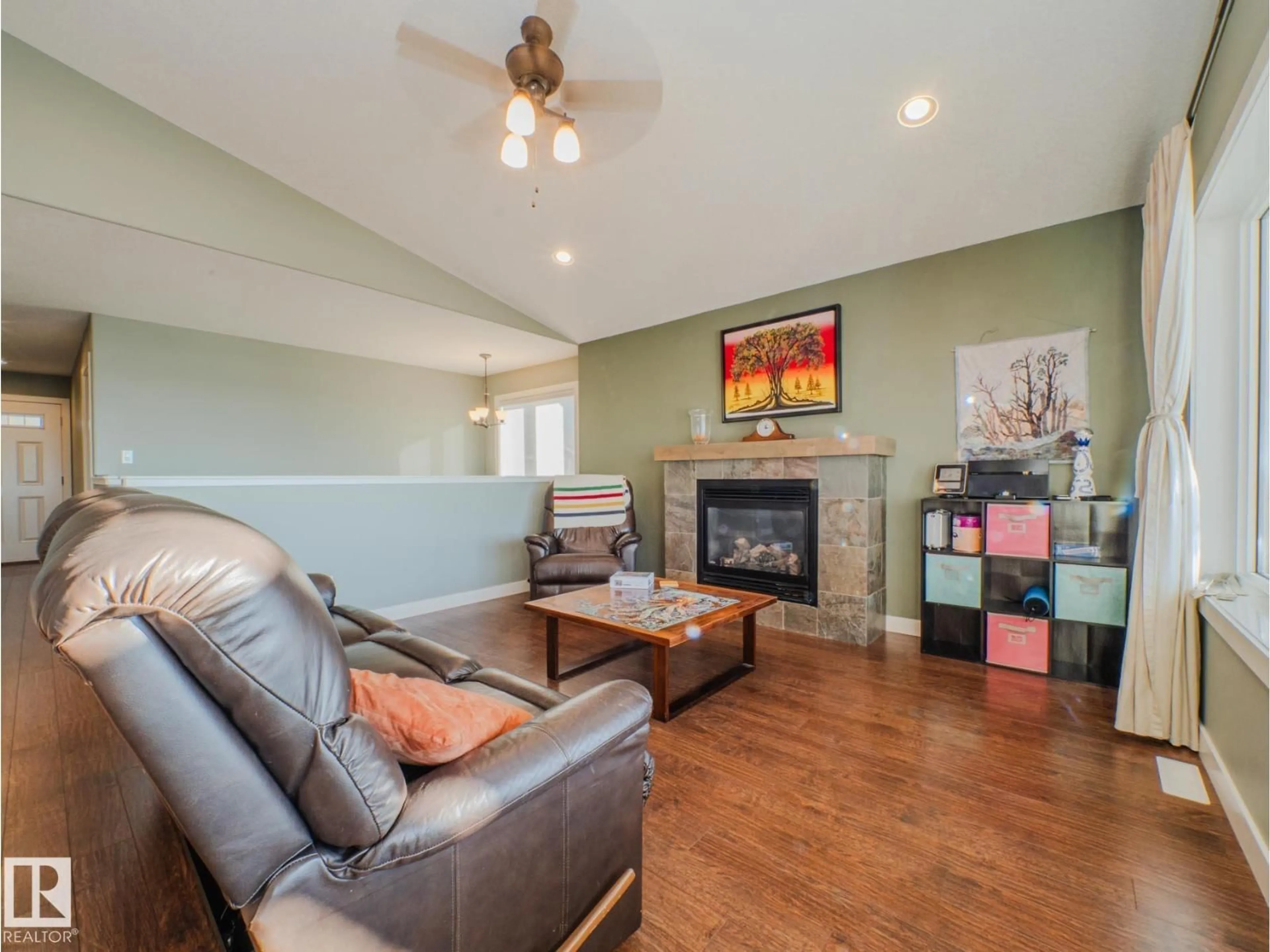 Living room with furniture, wood/laminate floor for 55101 STE. ANNE TR, Rural Lac Ste. Anne County Alberta T0E1A1