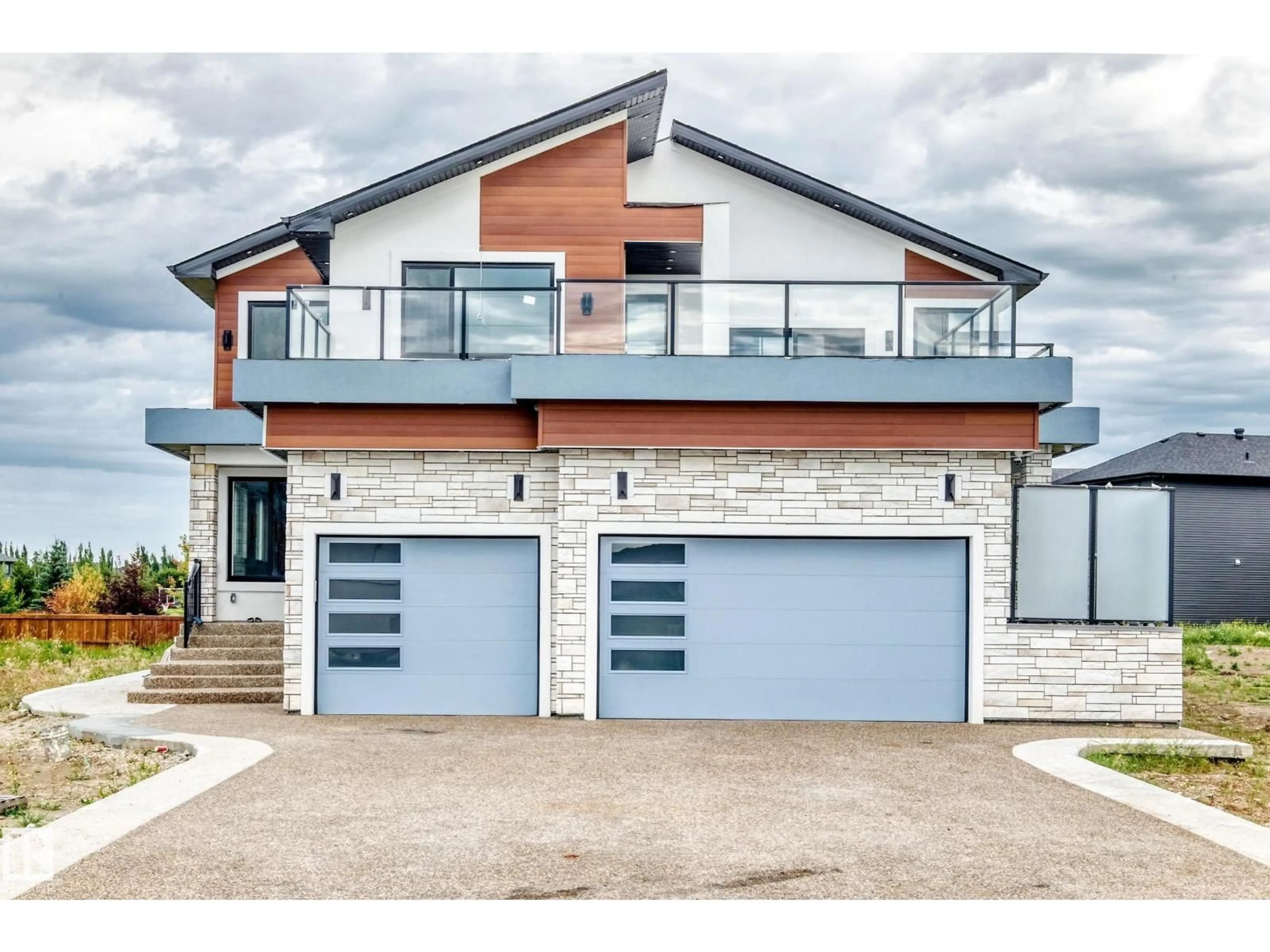Home with brick exterior material, street for NE - 6111 27 ST, Rural Leduc County Alberta T0C2K0