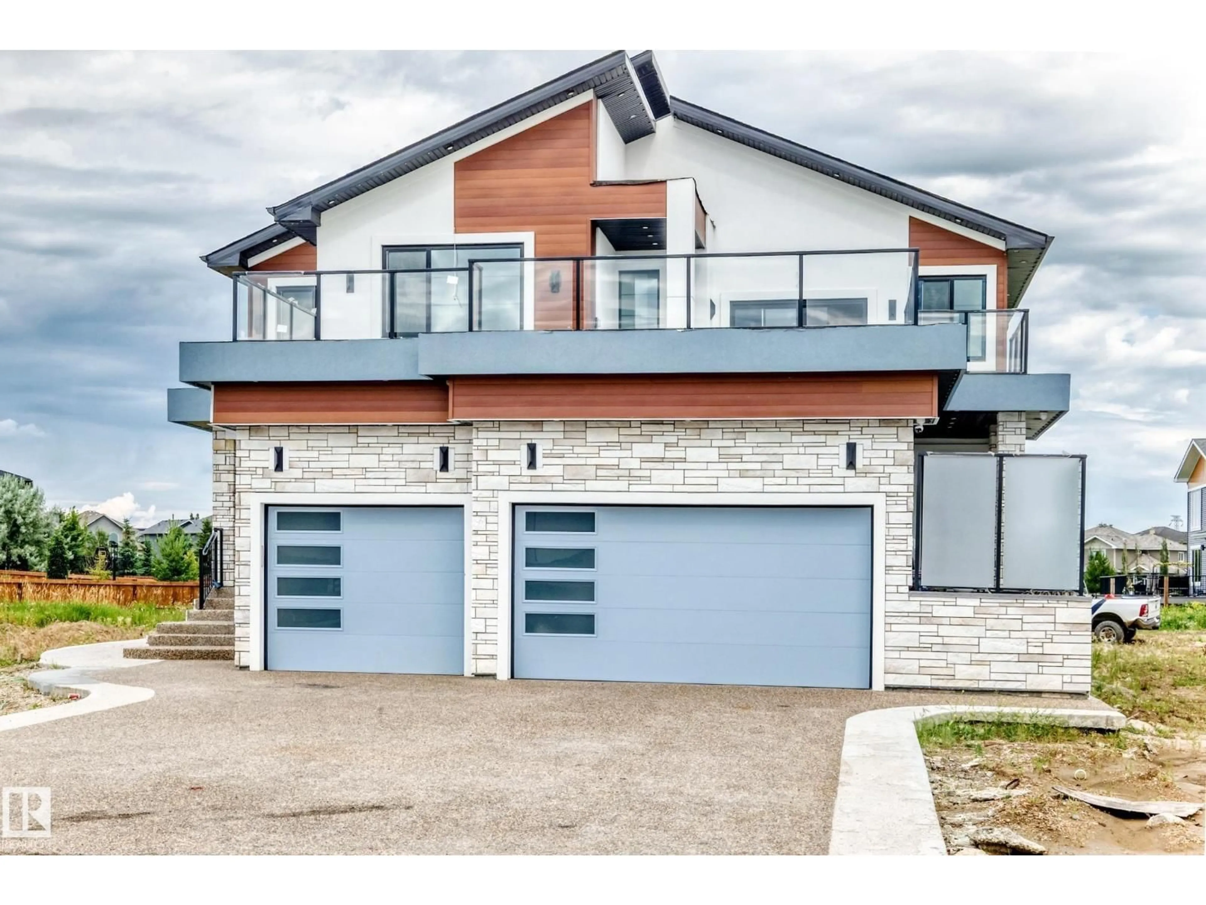 Home with brick exterior material, street for NE - 6111 27 ST, Rural Leduc County Alberta T0C2K0