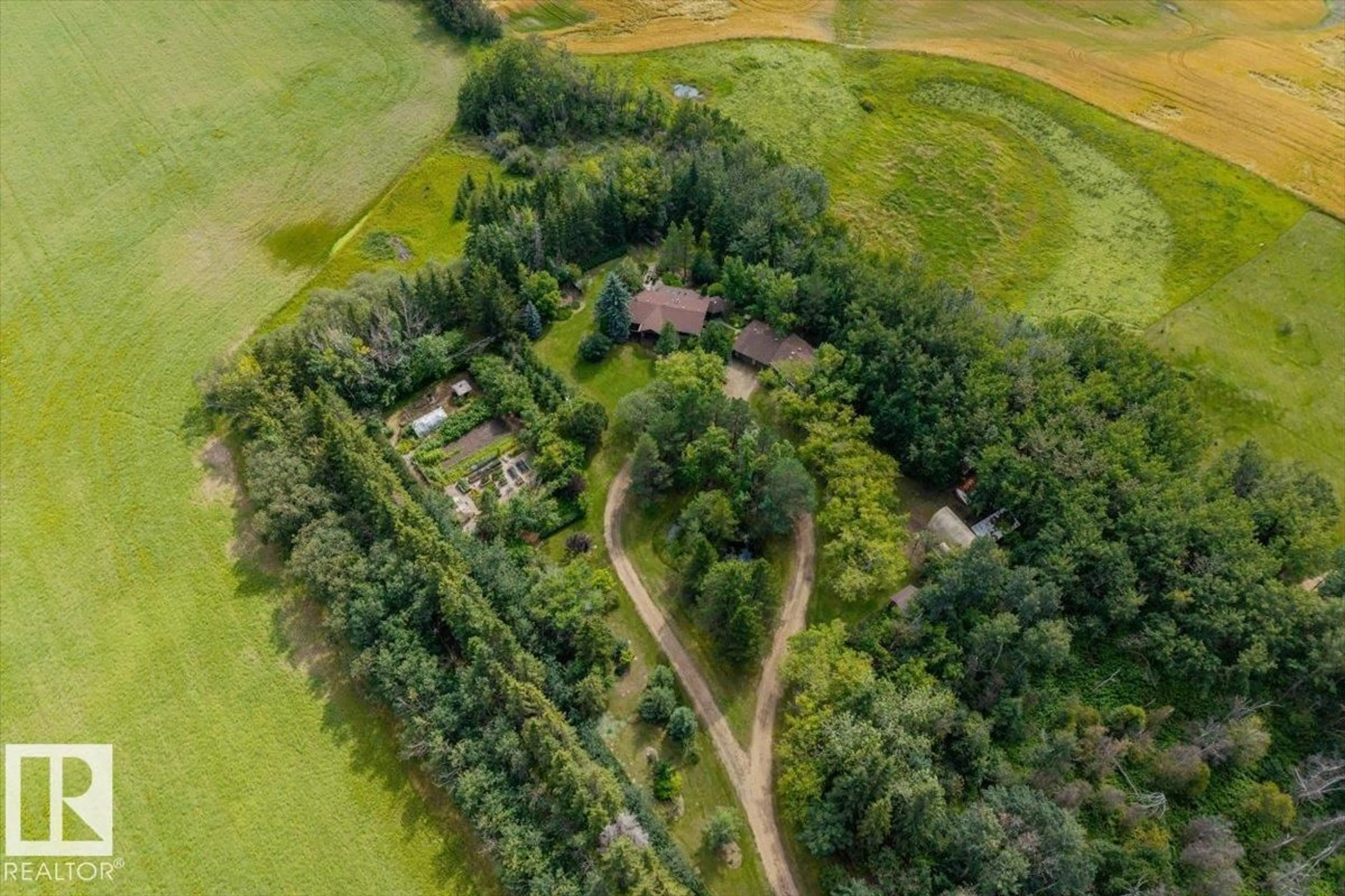A pic from outside/outdoor area/front of a property/back of a property/a pic from drone, forest/trees view for 56419 RGE ROAD 274, Rural Sturgeon County Alberta T8R1Y7