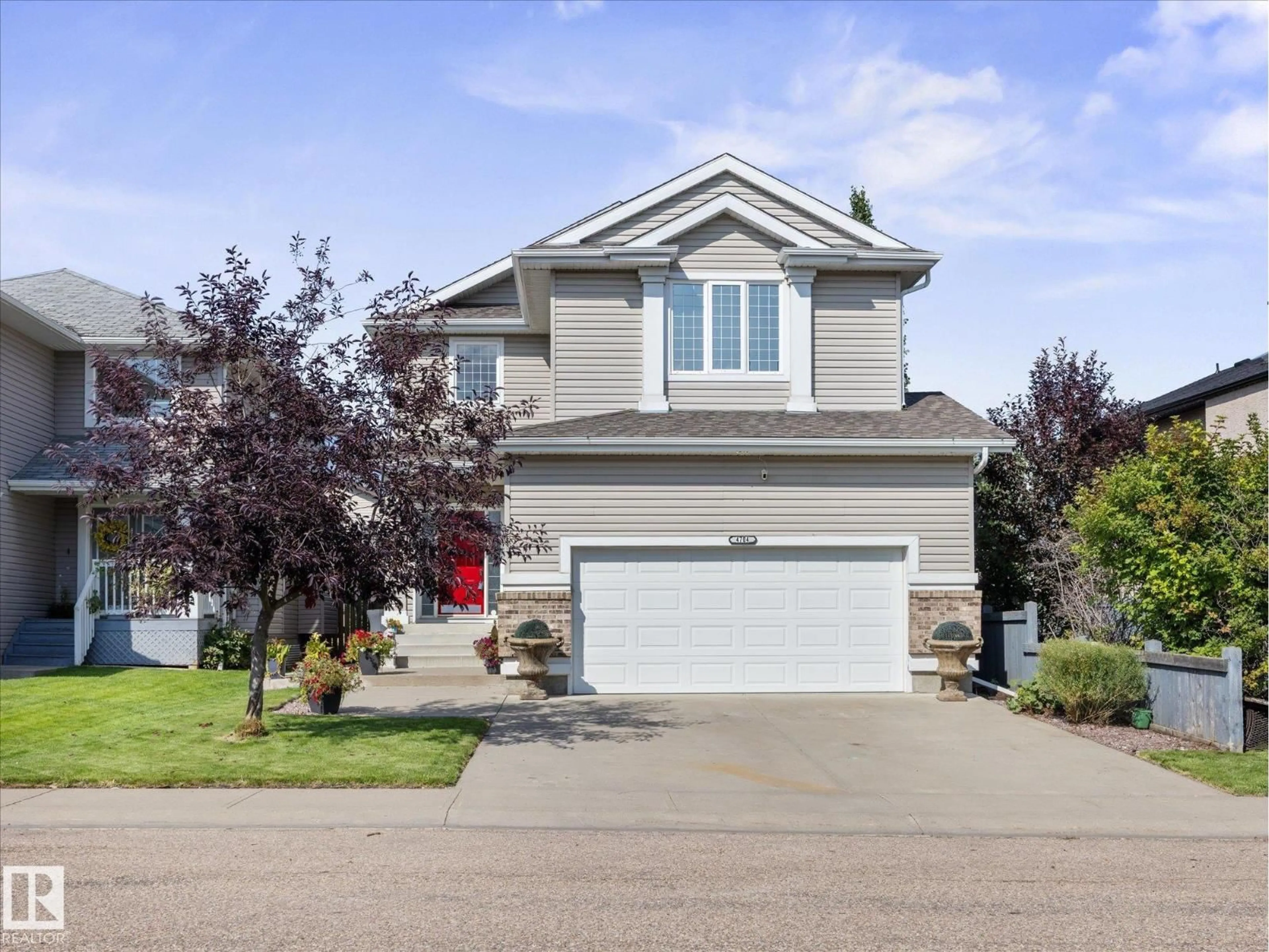 Home with vinyl exterior material, street for 4704 160 AV, Edmonton Alberta T5Y3M1