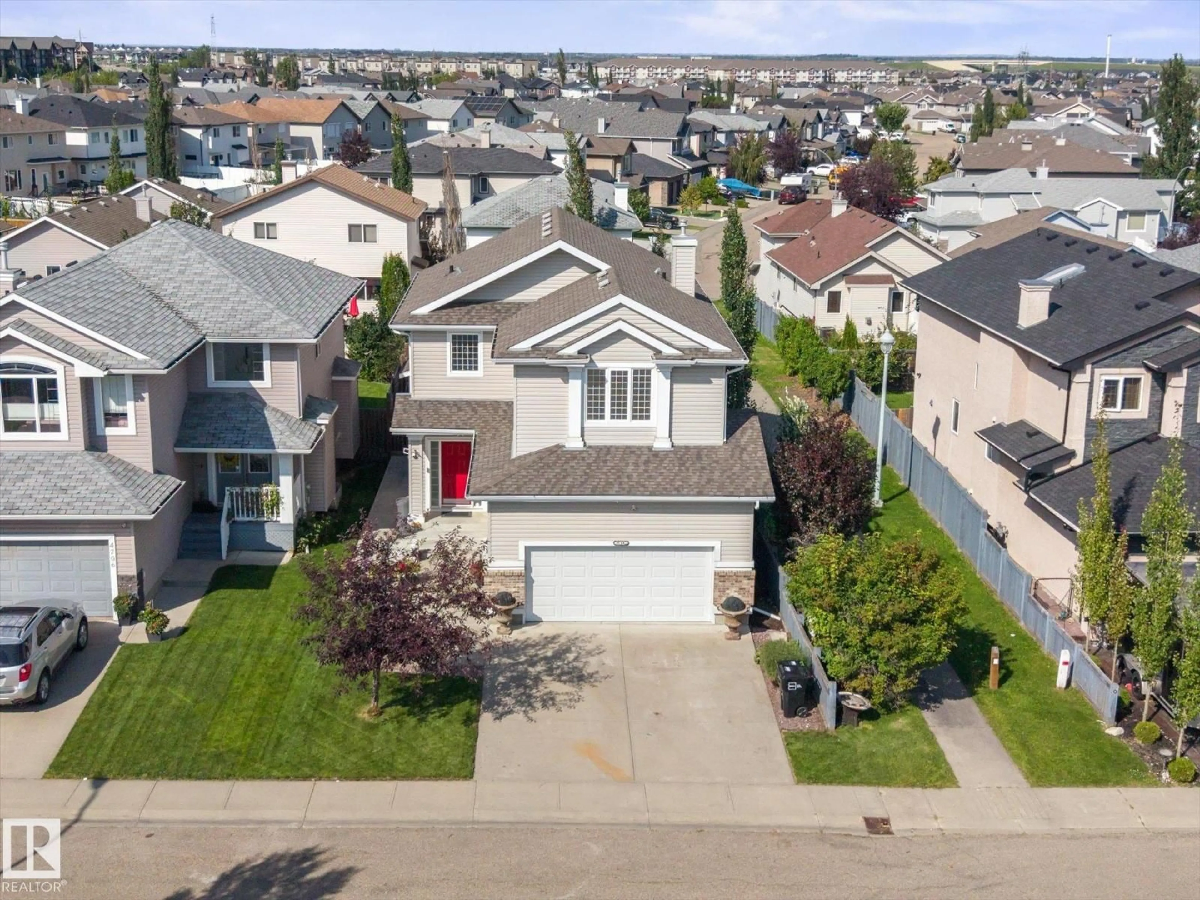 A pic from outside/outdoor area/front of a property/back of a property/a pic from drone, street for 4704 160 AV, Edmonton Alberta T5Y3M1