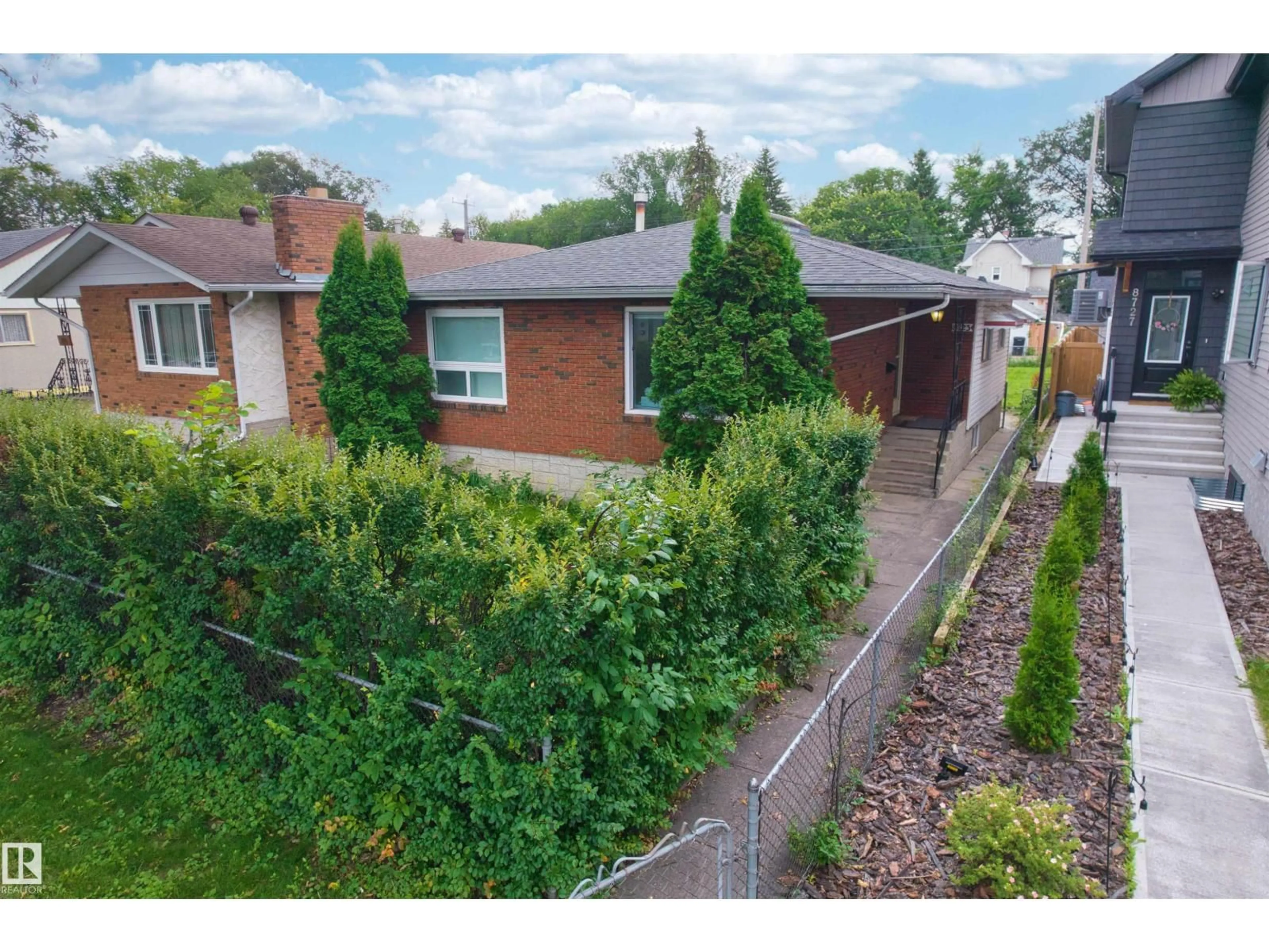 A pic from outside/outdoor area/front of a property/back of a property/a pic from drone, street for 8723 81 AV, Edmonton Alberta T6C0W5