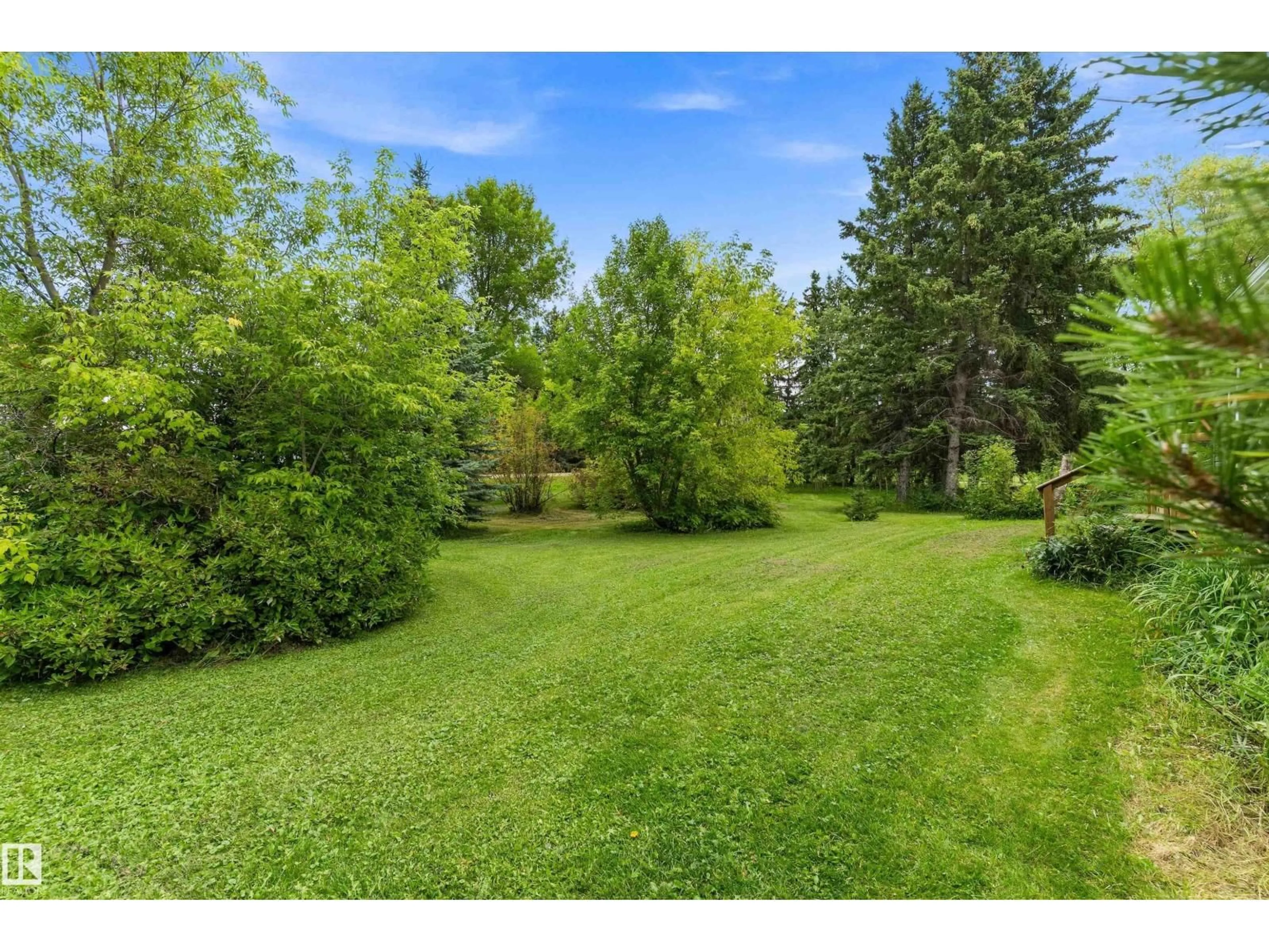 A pic from outside/outdoor area/front of a property/back of a property/a pic from drone, forest/trees view for 37 - 53431 RGE ROAD 221, Rural Strathcona County Alberta T8E2K8