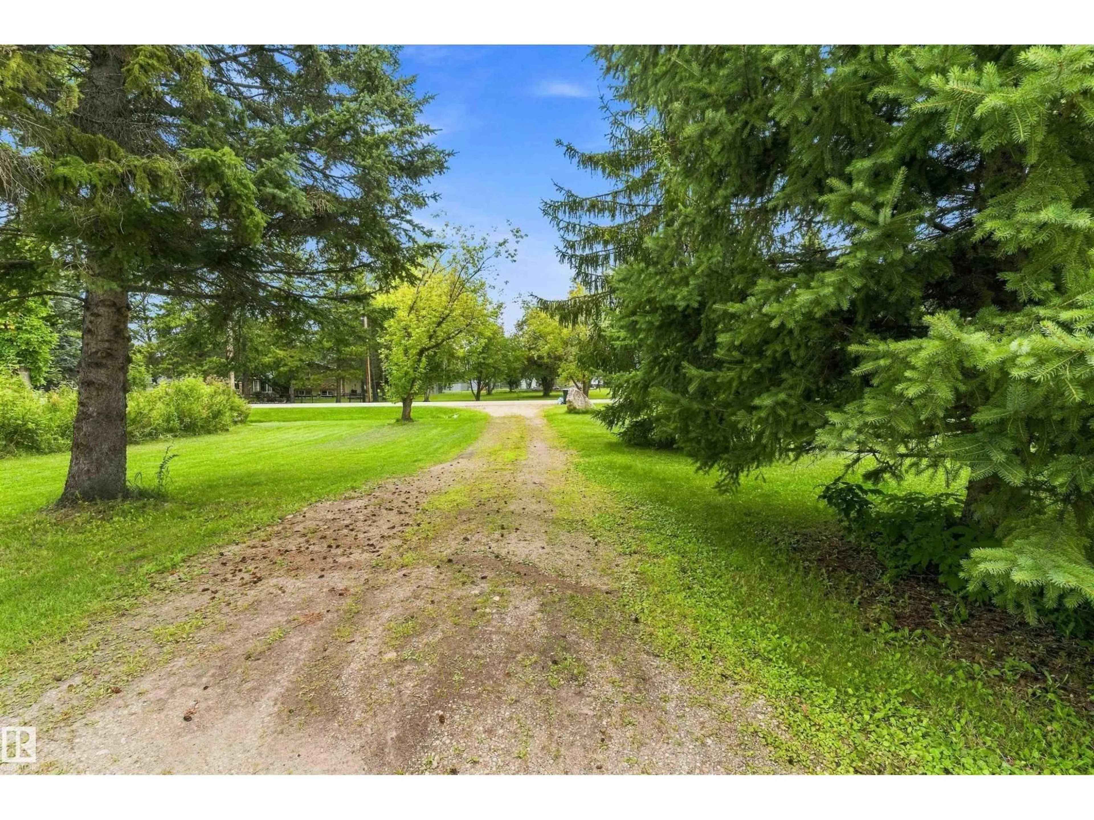 A pic from outside/outdoor area/front of a property/back of a property/a pic from drone, forest/trees view for 37 - 53431 RGE ROAD 221, Rural Strathcona County Alberta T8E2K8