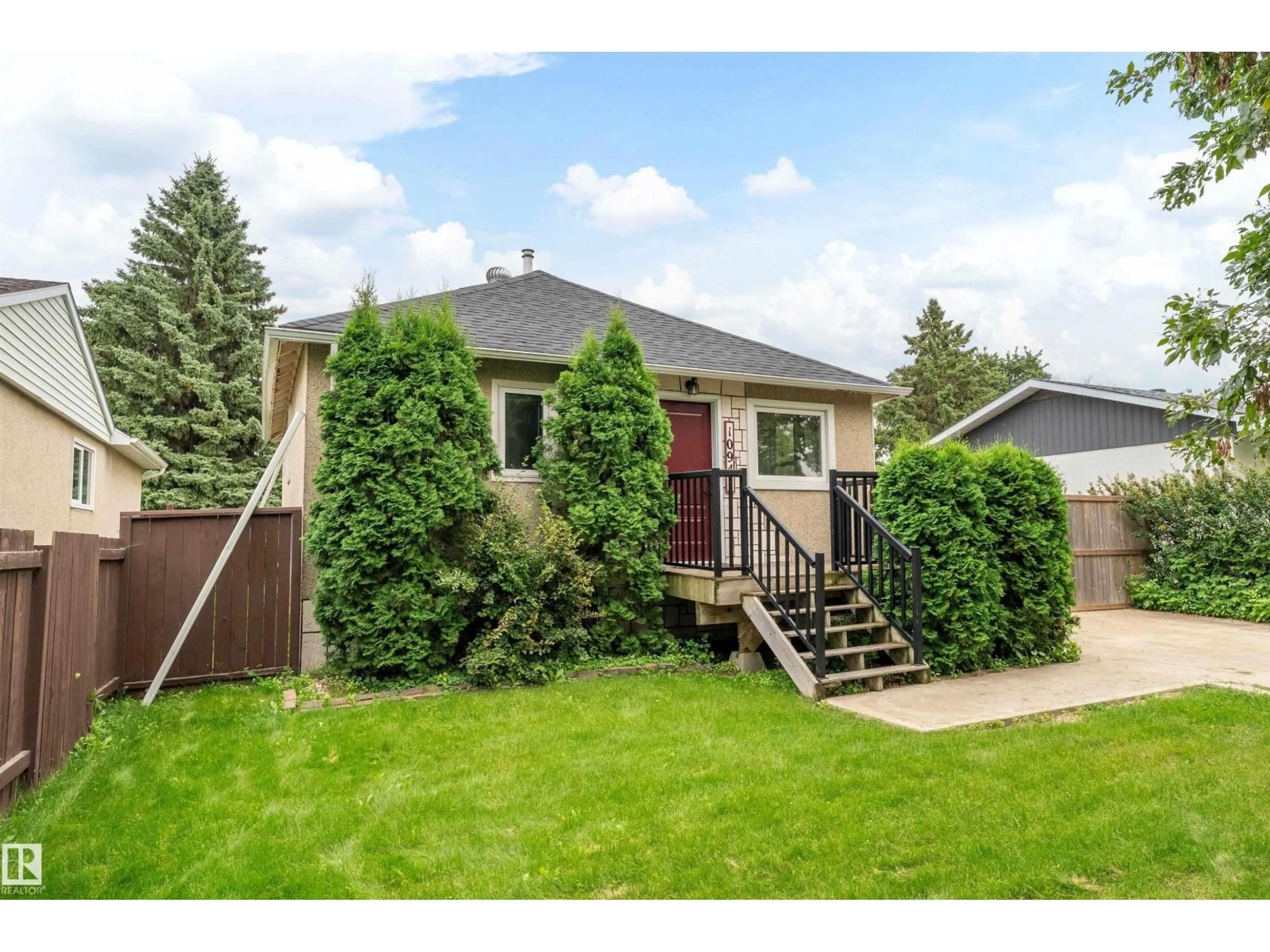 Home with vinyl exterior material, street for 10941 150 ST, Edmonton Alberta T5P1R8