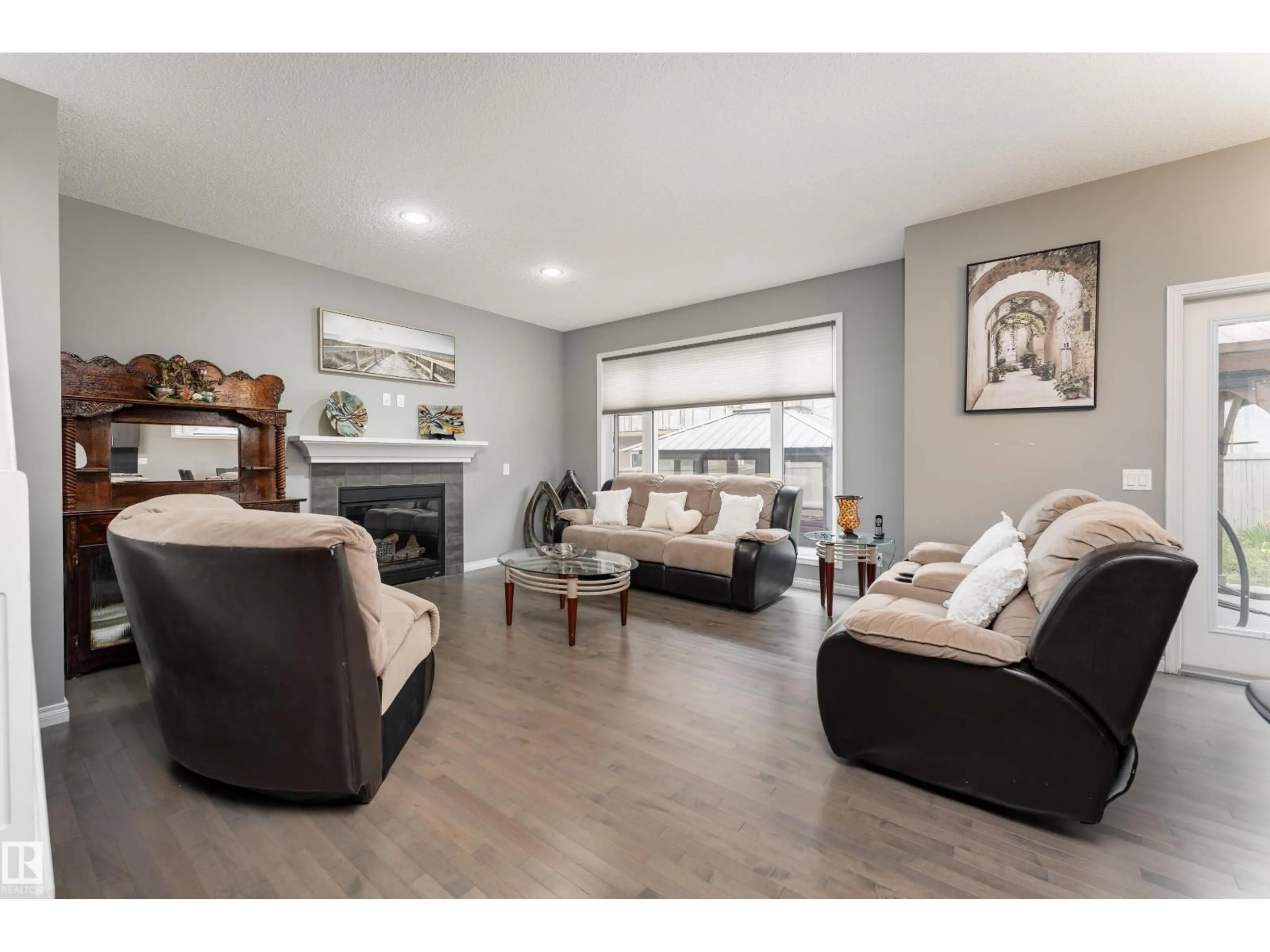Living room with furniture, wood/laminate floor for 2055 REDTAIL CM, Edmonton Alberta T5S0H3