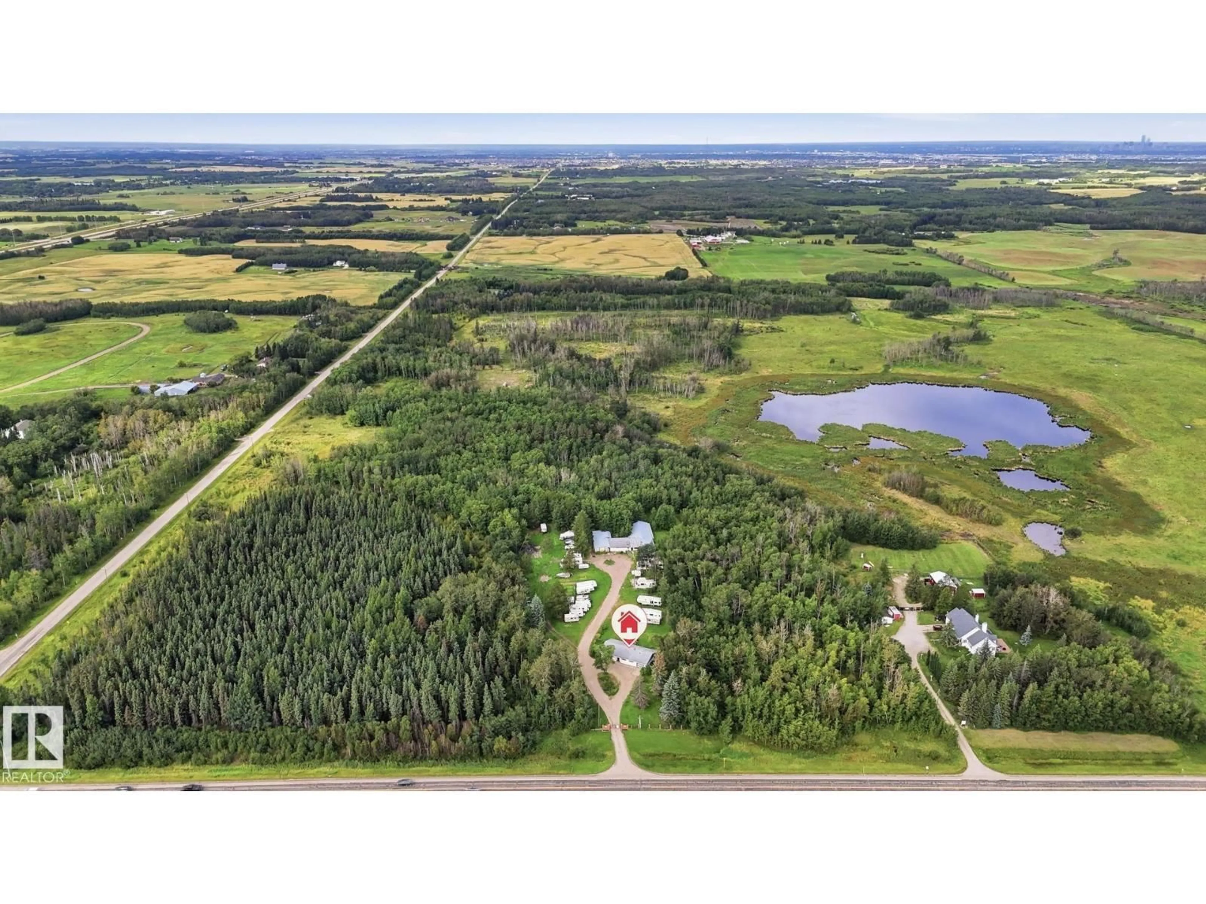A pic from outside/outdoor area/front of a property/back of a property/a pic from drone, unknown for 52012 HWY 21, Rural Strathcona County Alberta T8B1J6