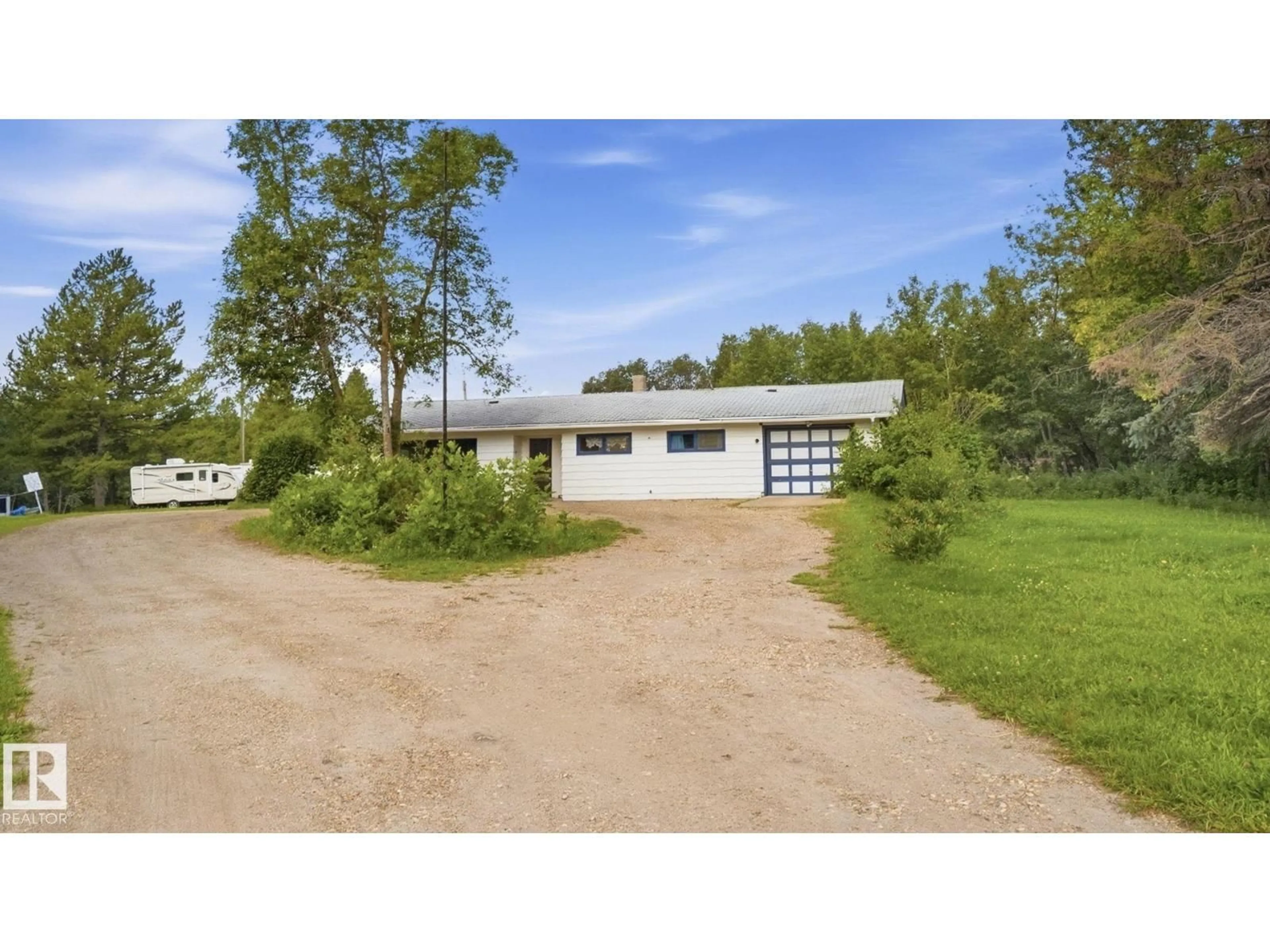 A pic from outside/outdoor area/front of a property/back of a property/a pic from drone, unknown for 52012 HWY 21, Rural Strathcona County Alberta T8B1J6