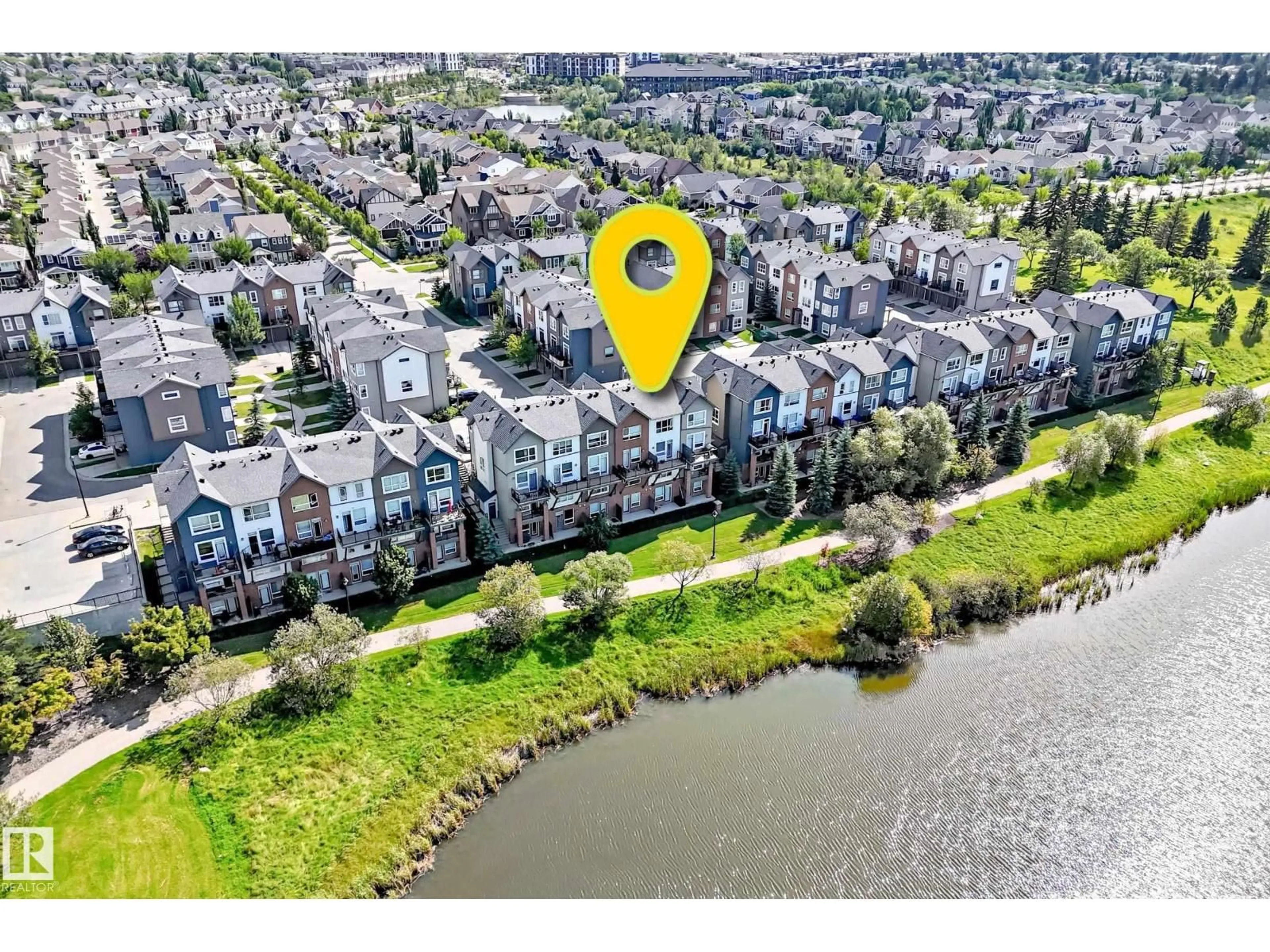 A pic from outside/outdoor area/front of a property/back of a property/a pic from drone, water/lake/river/ocean view for NW - 60 2560 PEGASUS BV, Edmonton Alberta T5E6V4